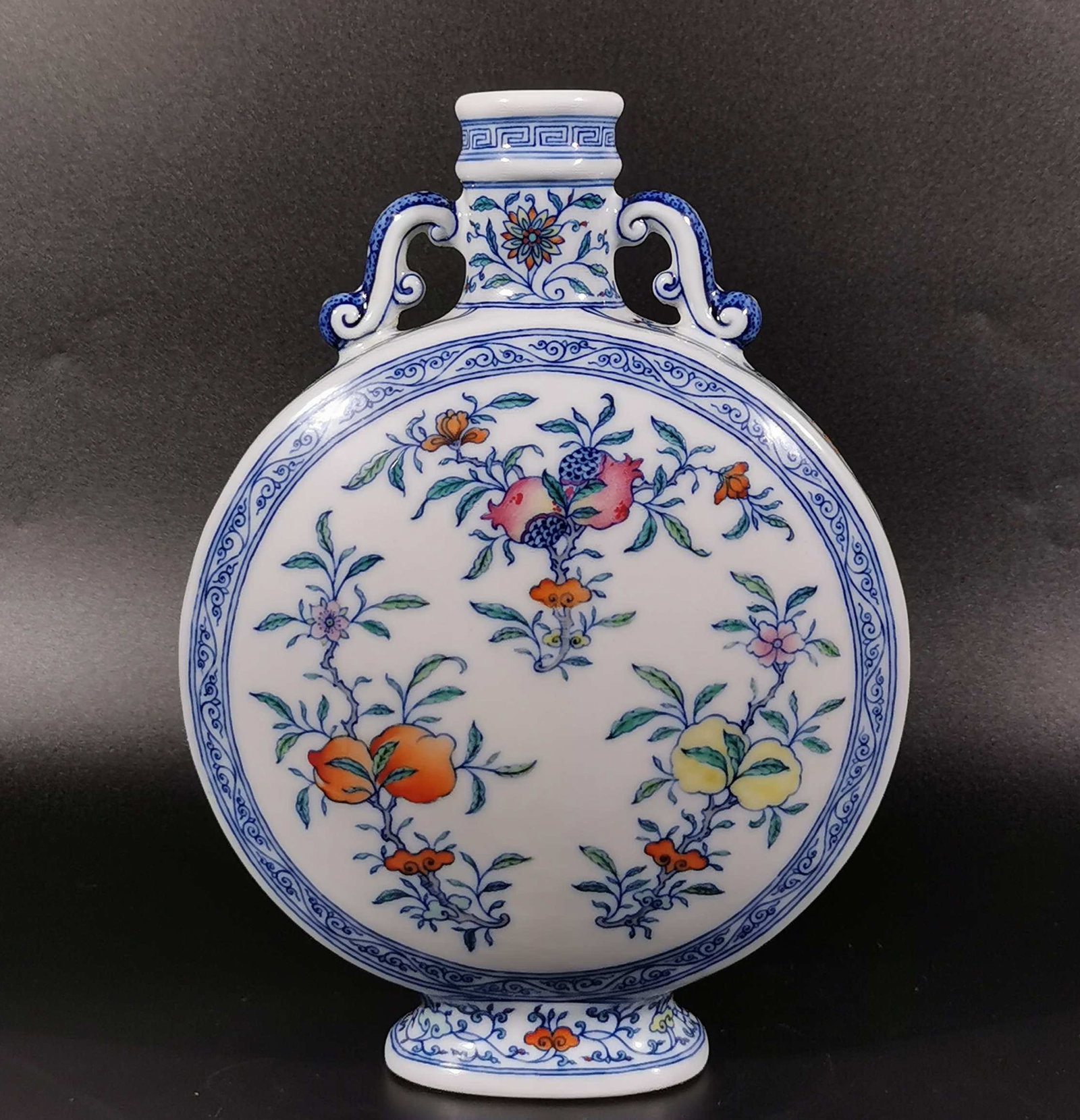 An Exquisite Blue and White Doucai Flower and Fruit Pattern Vase: An Exquisite Blue and White Doucai Flower and Fruit Pattern Vase,Qing Dynasty, China,Yongzheng Six-character Mark,Size:9.8inx6.9in 青花斗彩花果纹瓶,