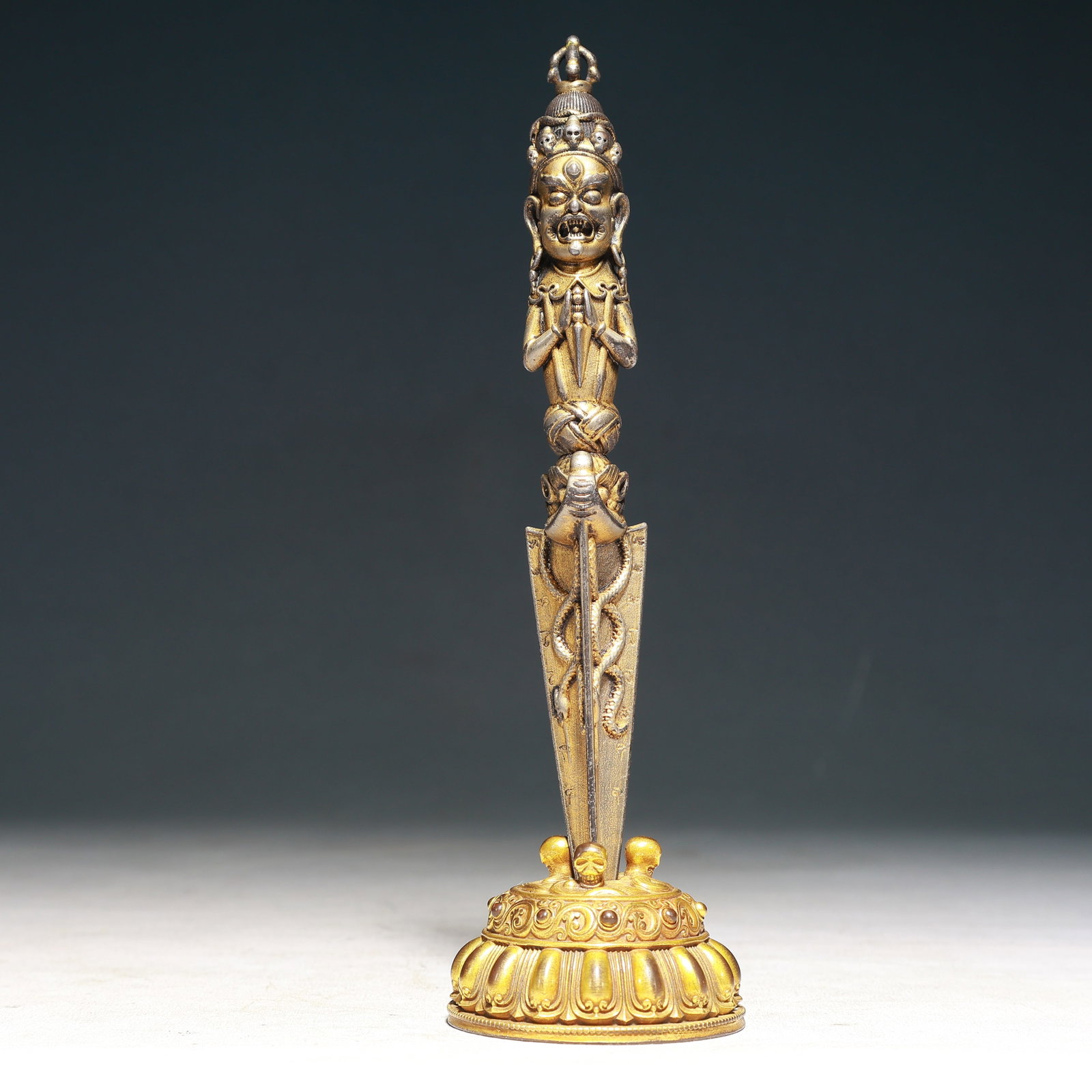 An Exquisite Gilt Bronze Buddha-Face Pattern Vajry Pestle,With Base: An Exquisite Gilt Bronze Buddha-Face Pattern Vajry Pestle,With Base,Qing Dynasty,China,Size:2.6inx8.9in,Weight:500g