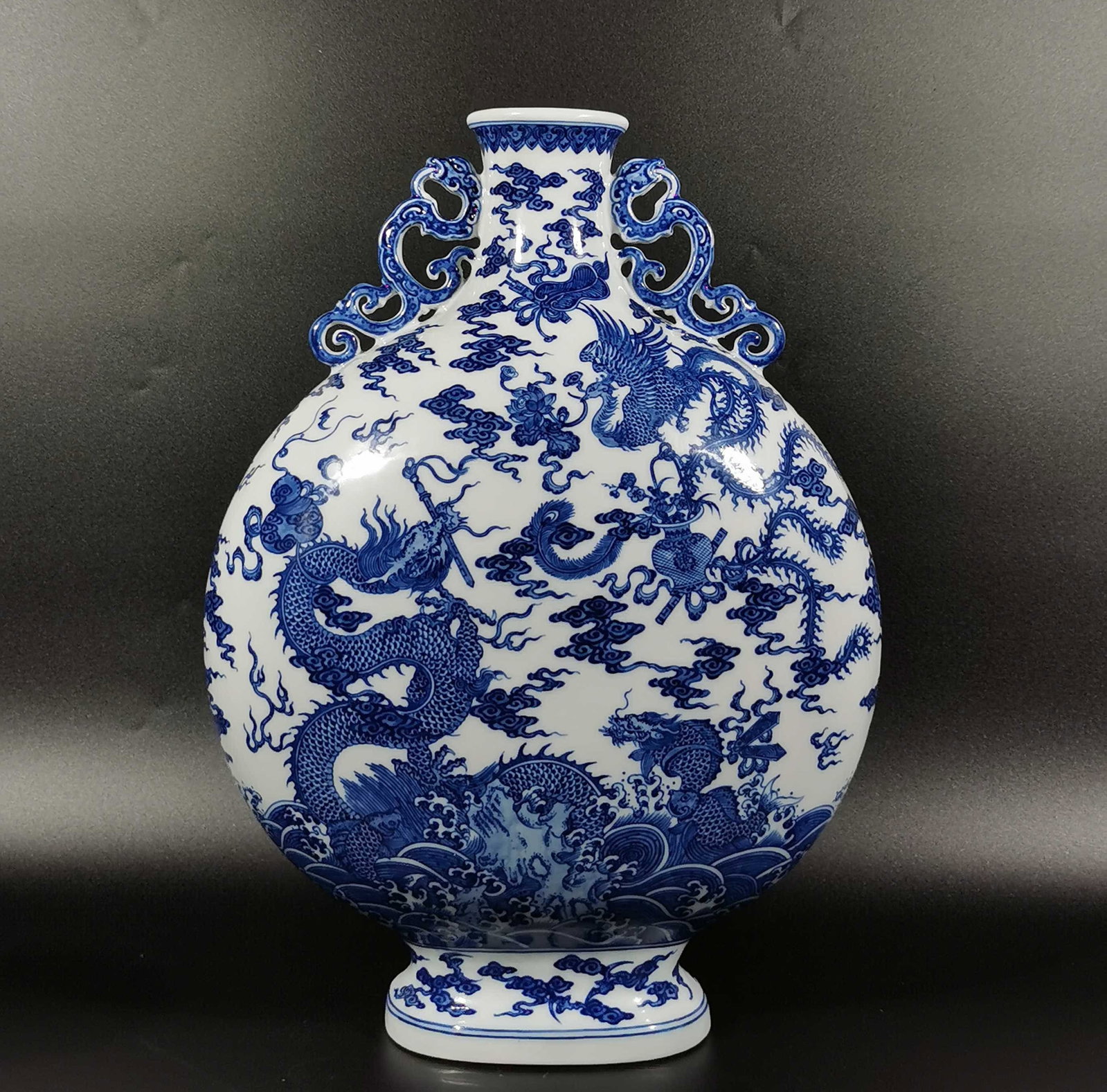 A Huge Blue and White Auspicious Cloud,Dragon and Phoenix Pattern Dragon-Ears Vase: A Huge Blue and White Auspicious Cloud,Dragon and Phoenix Pattern Dragon-Ears Vase,Qing Dynasty, China,Qianlong Six-character Mark,Size:16.9inx12.3in