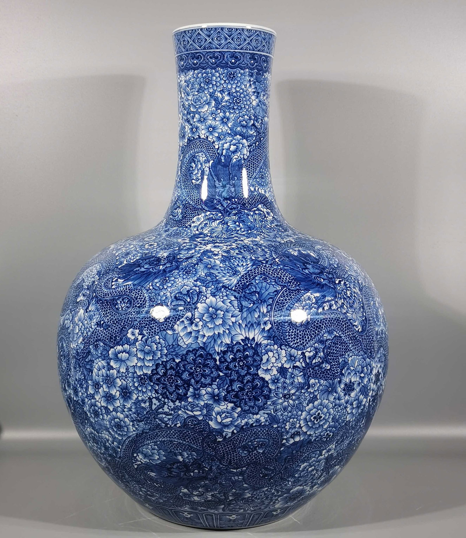 A Huge Blue and White Flower and Dragon Pattern Vase: A Huge Blue and White Flower and Dragon Pattern Vase,Qing Dynasty, China,Qianlong Six-character Mark,Size:22.8inx4.9inx15.6in