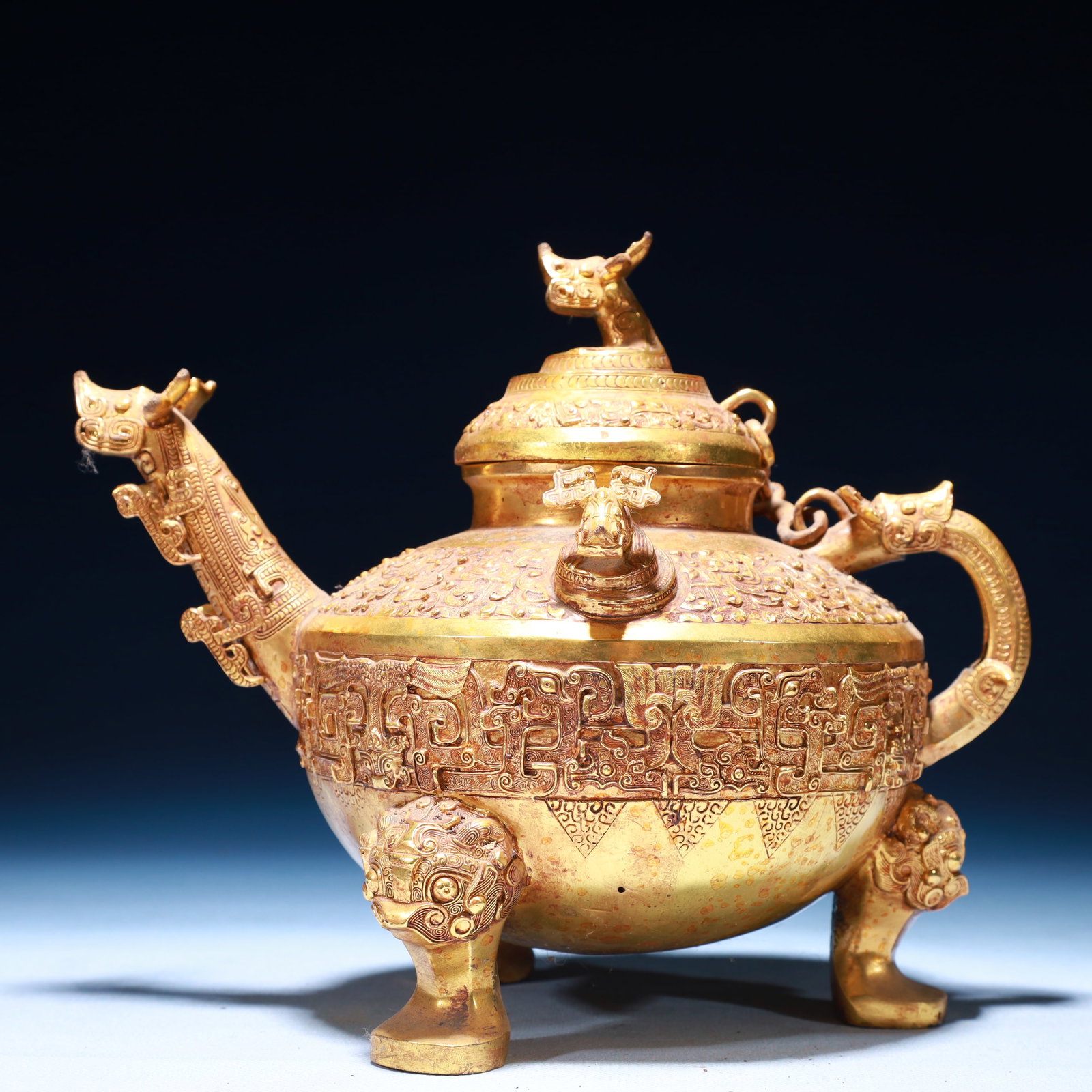 An Exquisite Gilt Bronze Auspicious Beast Pattern Tripod Jar with Cover: An Exquisite Gilt Bronze Auspicious Beast Pattern Tripod Jar with Cover,Qing Dynasty,China,Size:9.1inx6.7inx8.7in,Weight:1350g 铜鎏金瑞兽纹三足盖&