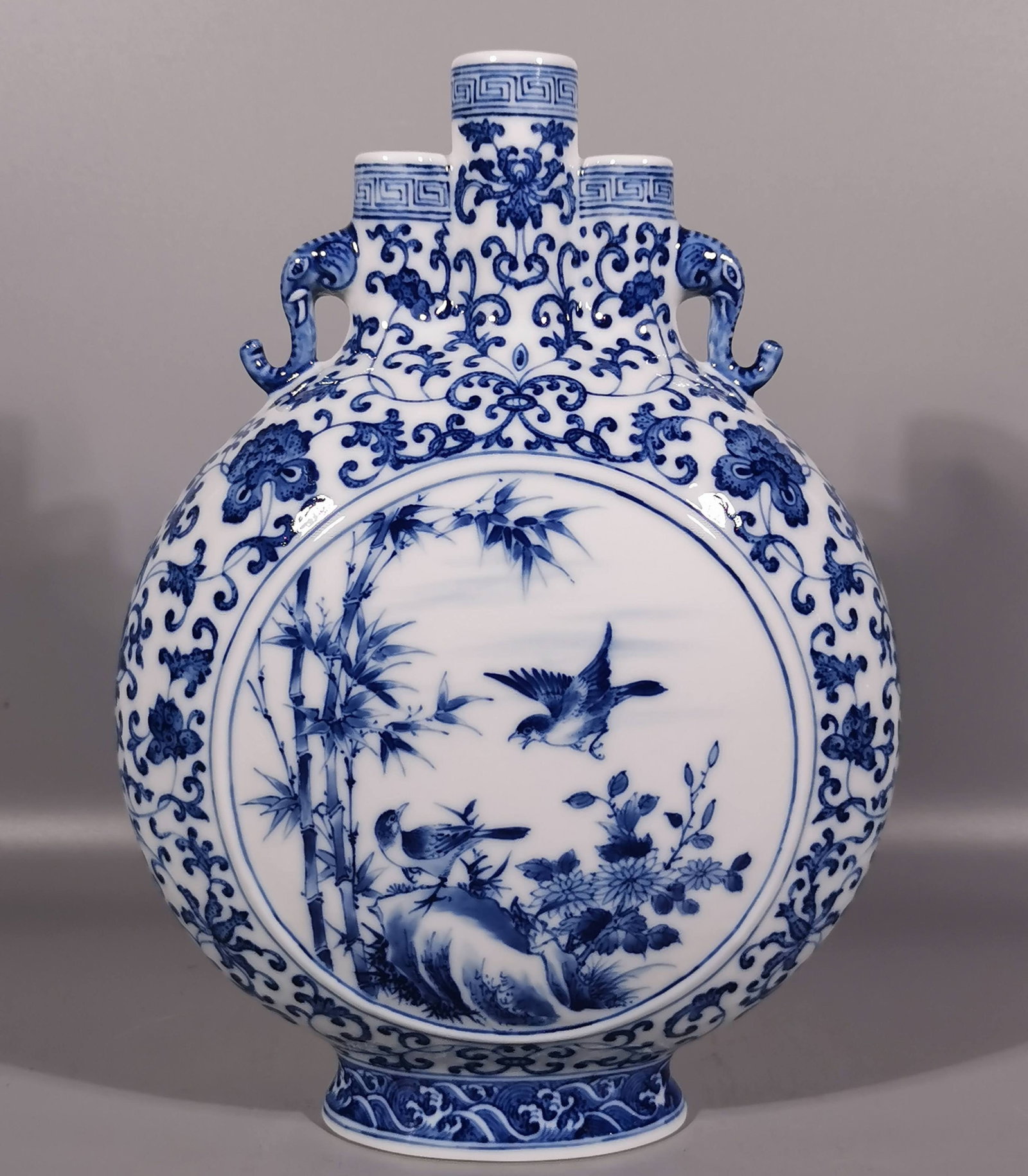 An Exquisite Blue and White Flower and Bird Pattern Elephant-Ears Vase: An Exquisite Blue and White Flower and Bird Pattern Elephant-Ears Vase,Qing Dynasty, China,Yongzheng Six-character Mark,Size:11.6inx8.5in 青花花鸟纹象耳ல