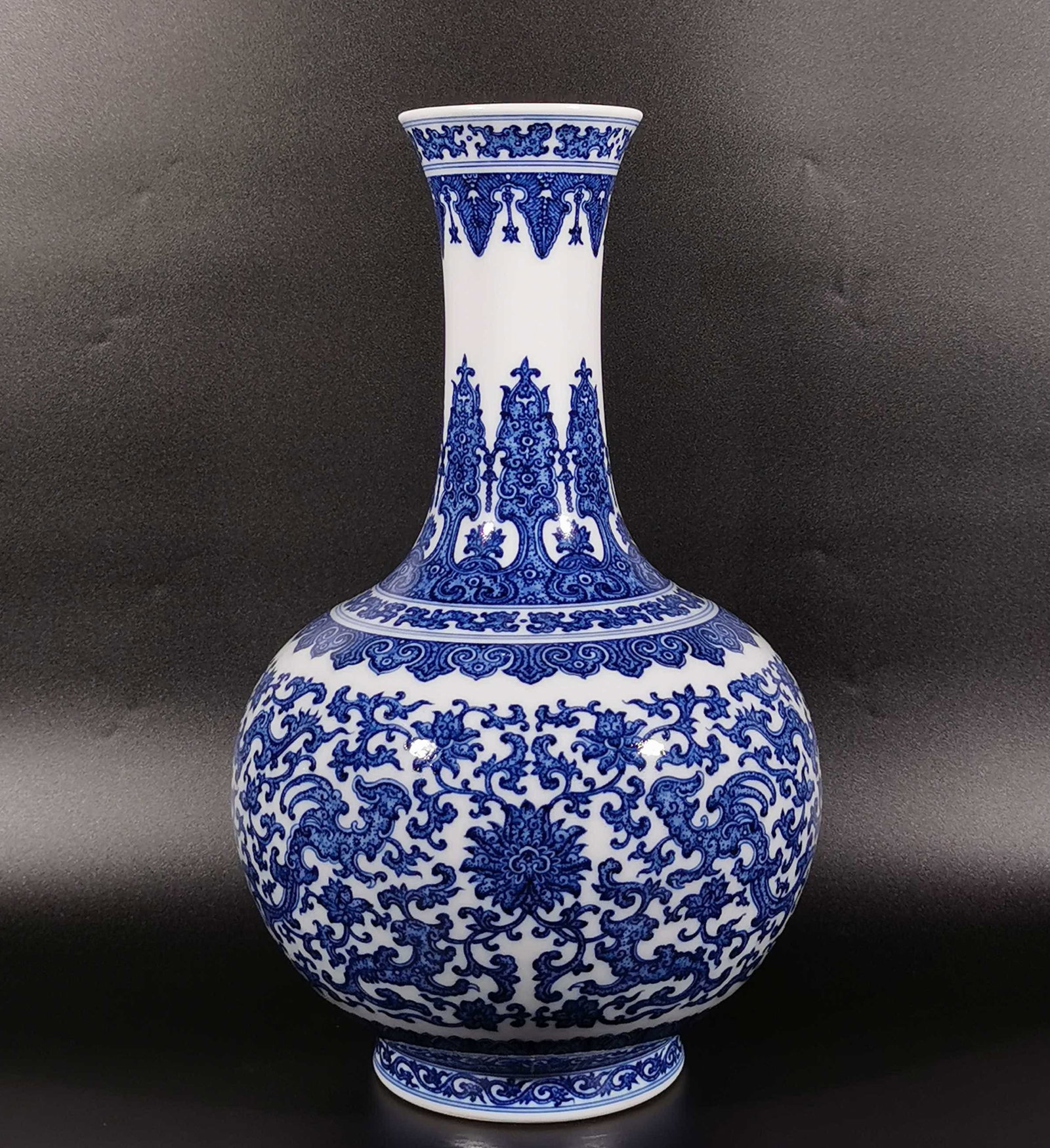 A Rare Blue and White Lotus and Phoenix Pattern Vase: A Rare Blue and White Lotus and Phoenix Pattern Vase,Qing Dynasty, China,Qianlong Six-character Mark,Size:15.2inx3.8inx9.1in 青花缠枝莲凤纹瓶,中&#