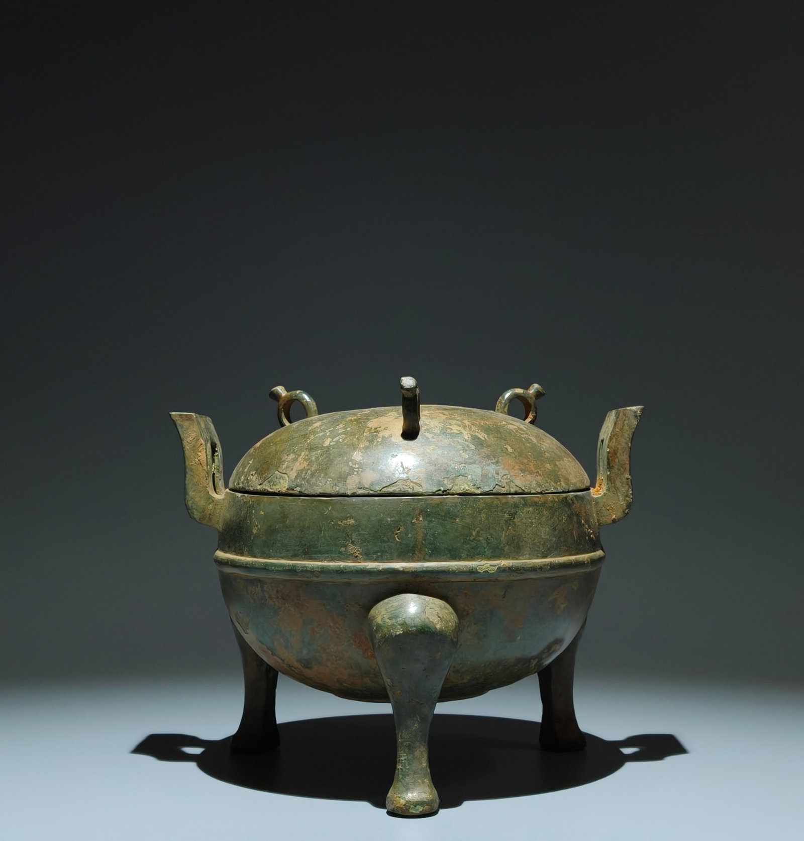 An Archaic Bronze Double-Ears Tripod Censer,With Inscription: An Archaic Bronze Double-Ears Tripod Censer,With Inscription,the Warring States period in China,Size:7.3inx9.1inx7.1in