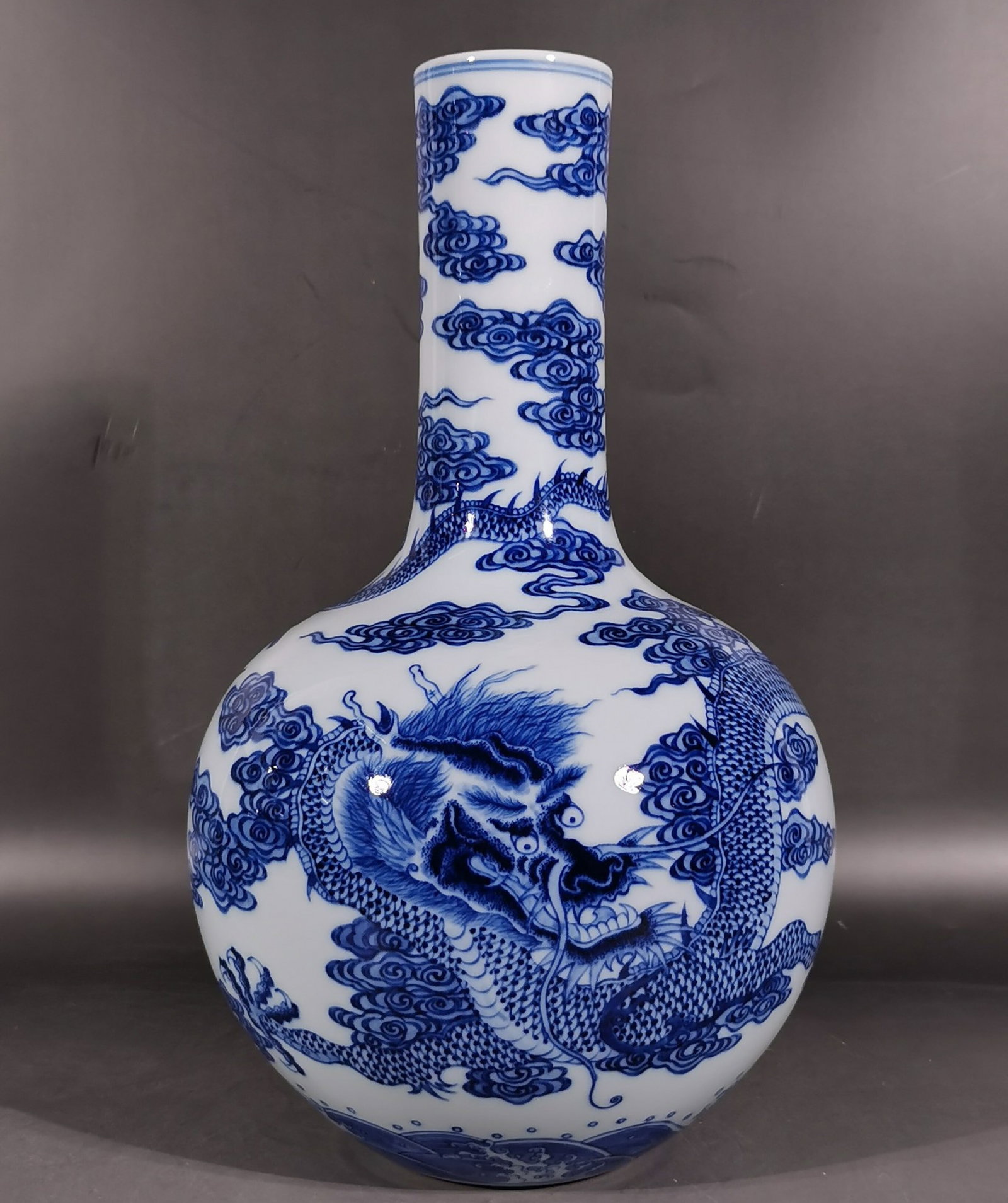 A Rare Blue and White Seawater,Auspicious Cloud and Dragon Pattern Vase: A Rare Blue and White Seawater,Auspicious Cloud and Dragon Pattern Vase,Qing Dynasty, China,Qianlong Six-character Mark,Size:14.4inx2.6inx8.7in 青花海水祥云龙