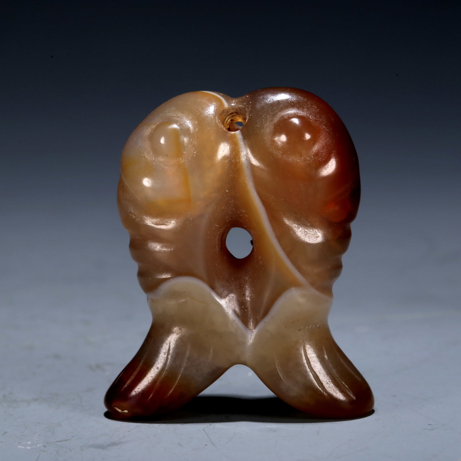 A Hongshan Culture Agate 'Fish' Pendant (1 of 4)