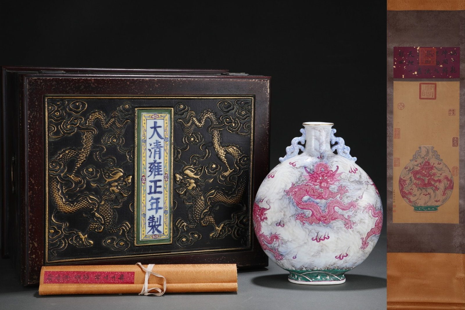 A Rare Ink Color Ruby Red-Glazed Auspicious Cloud and Dragon Pattern Double-Ears Vase,with Chinese: A Rare Ink Color Ruby Red-Glazed Auspicious Cloud and Dragon Pattern Double-Ears Vase,with Chinese Vertical Scroll Ink Painting on Silk,Qing Dynasty,China,Yongzheng Six-character Mark,Size:(Without fr