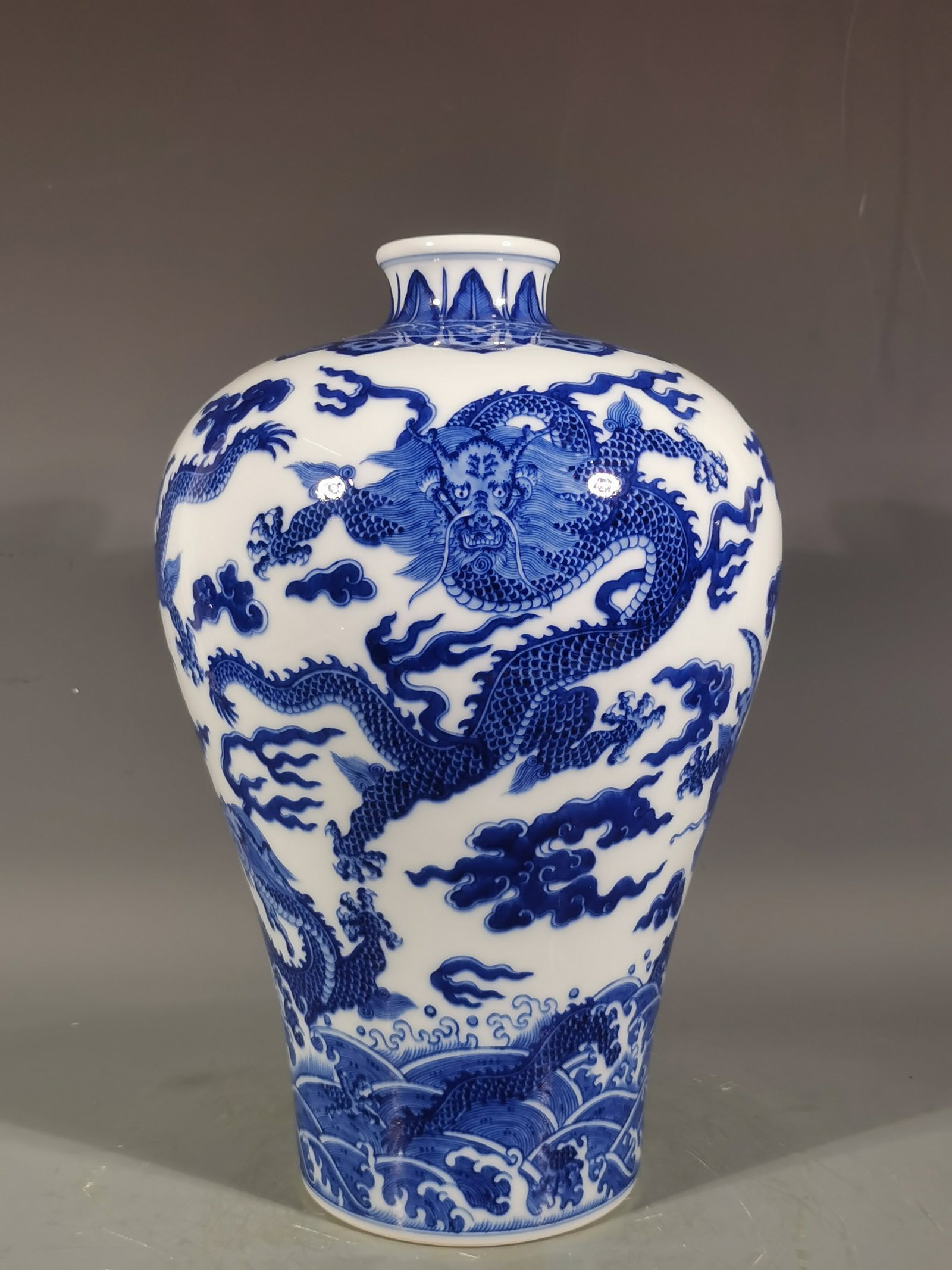 A Rare Blue and White Seawater,Auspicious Cloud and Dragon Pattern Vase: A Rare Blue and White Seawater,Auspicious Cloud and Dragon Pattern Vase,Qing Dynasty,China,Qianlong Six-character Mark,Size:14.7inx9.4in