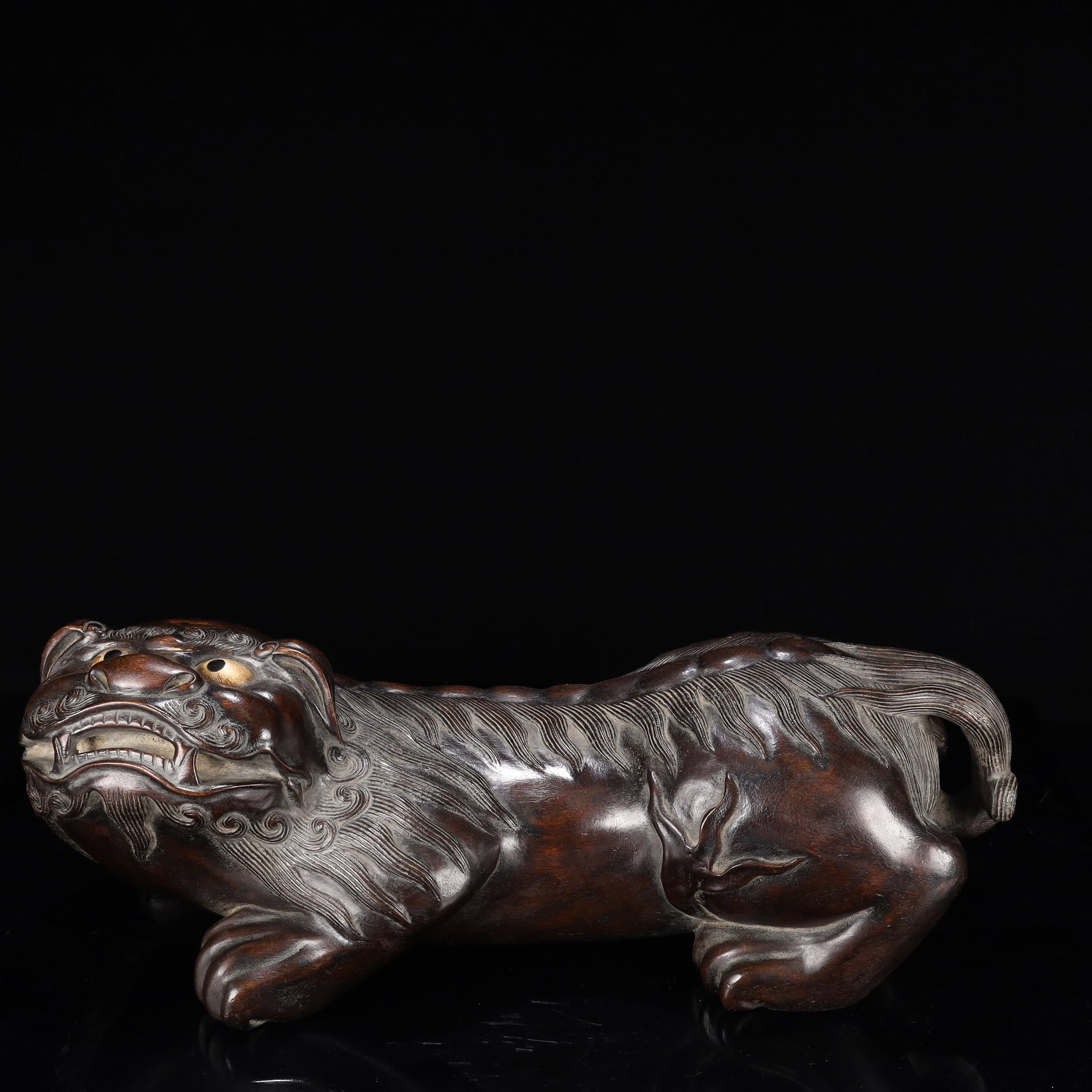 A Huge Eaglewood Lion Ornament: A Huge Eaglewood Lion Ornament,Qing Dynasty, China,Size:17.3inx6.7inx6.3in,Weight:2300g 沉香木狮子摆件,中国清代