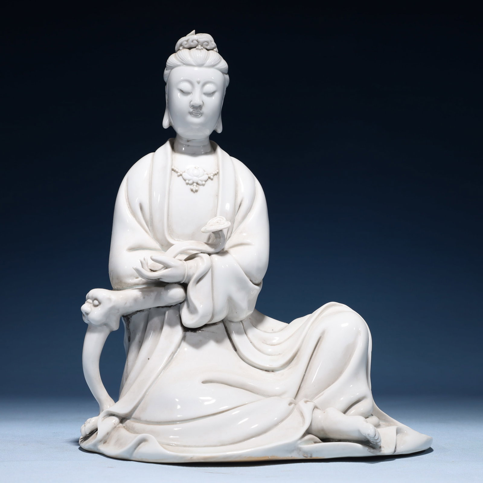 A Solemn Blance-De-Chine Statue of Avalokitesvara: A Solemn Blance-De-Chine Statue of Avalokitesvara Blance-De-Chine Statue of Avalokitesvara,Ming Dynasty,China,He Chaozong Mark,Size:9.1inx7.9inx11.4in,Weight:2150g 德化瓷观&