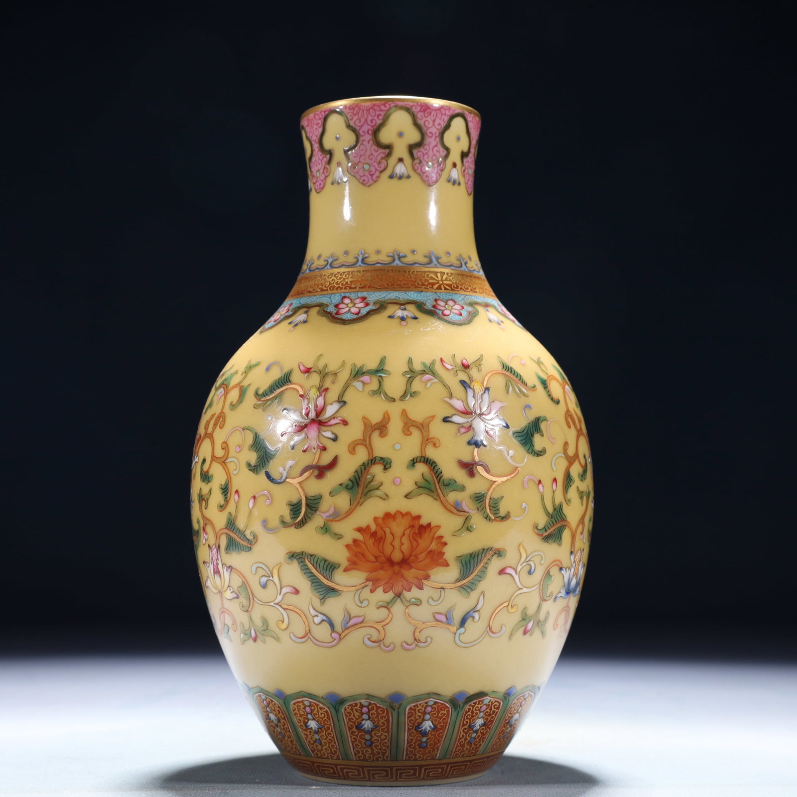 An Exquisite Yellow Ground Famille-Rose Lotus Pattern Vase: An Exquisite Yellow Ground Famille-Rose Lotus Pattern Vase,Qing Dynasty,China,Qianlong Six-character Mark,Size:4.3inx7.9in,Weight:550g 黄地粉彩缠枝莲纹&