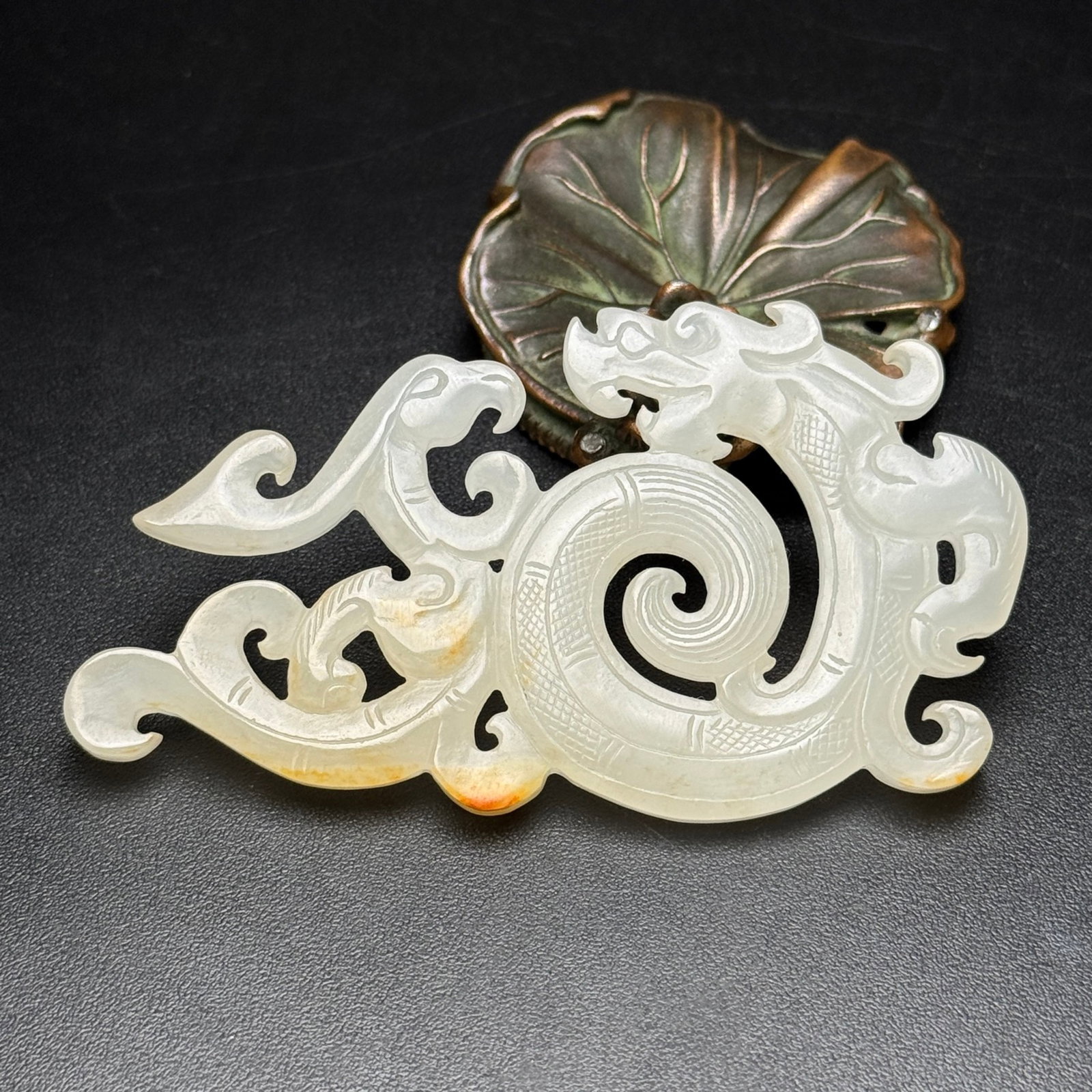 An Exquisite White Jade Hollow Dragon and Phoenix Pattern Pendant: An Exquisite White Jade Hollow Dragon and Phoenix Pattern Pendant,Qing Dynasty,China,Size:3.3inx1.8inx0.2in,Weight:29g 白玉镂空龙凤纹挂件,中