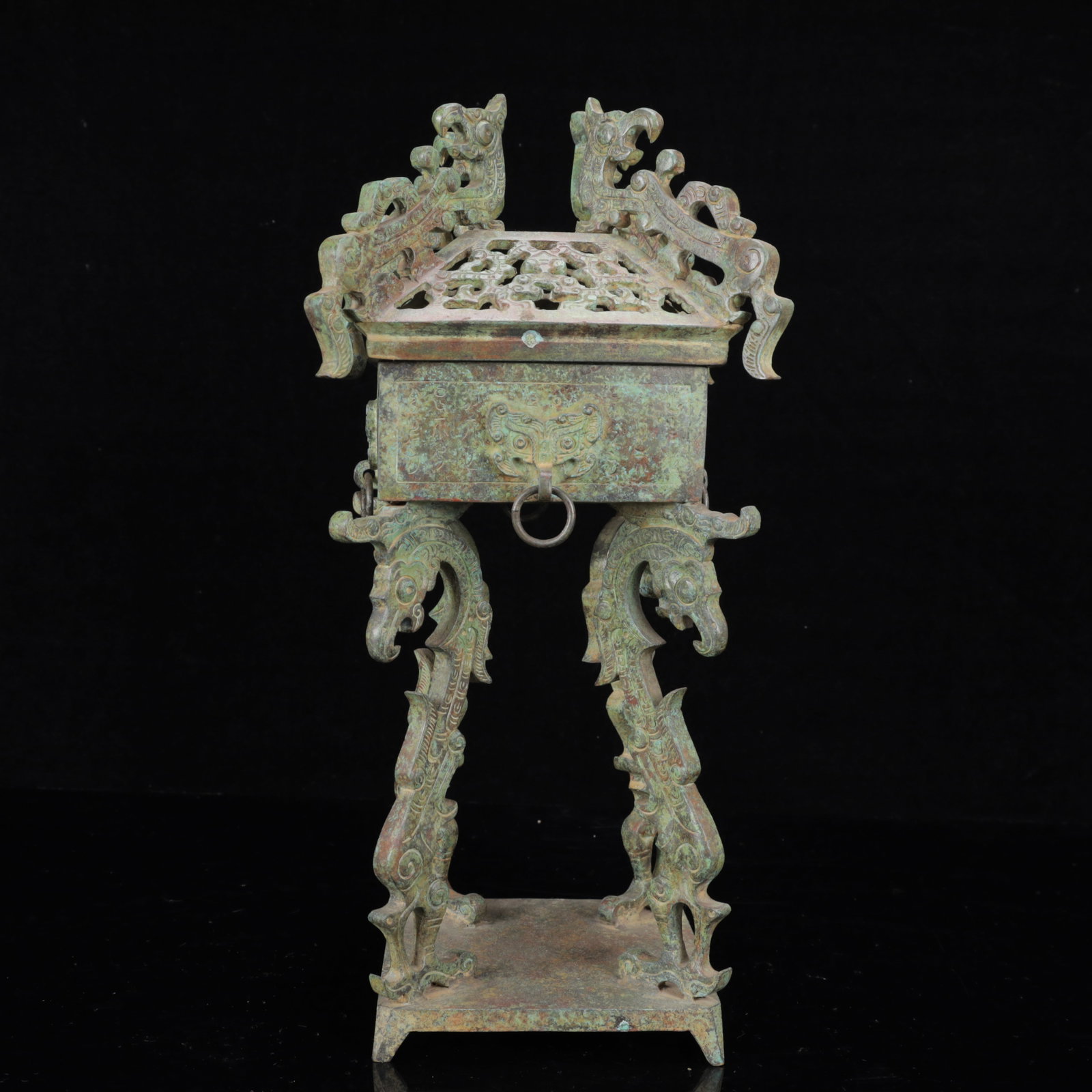 An Archaic Bronze Hollow Phoenix Pattern Double-Ears Censer: An Archaic Bronze Hollow Phoenix Pattern Double-Ears Censer,The Warring States period in China,Size:6.3inx14.6in,Weight:4700g 青铜镂空凤纹双耳香&#