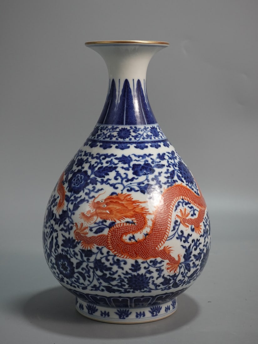 An Exquisite Blue and White Iron-Red Painted Gold Lotus and Dragon Pattern Vase: An Exquisite Blue and White Iron-Red Painted Gold Lotus and Dragon Pattern Vase,Qing Dynasty,China,Yongzheng Six-character Mark,Size:11inx7.1in 青花矾红釉描金
