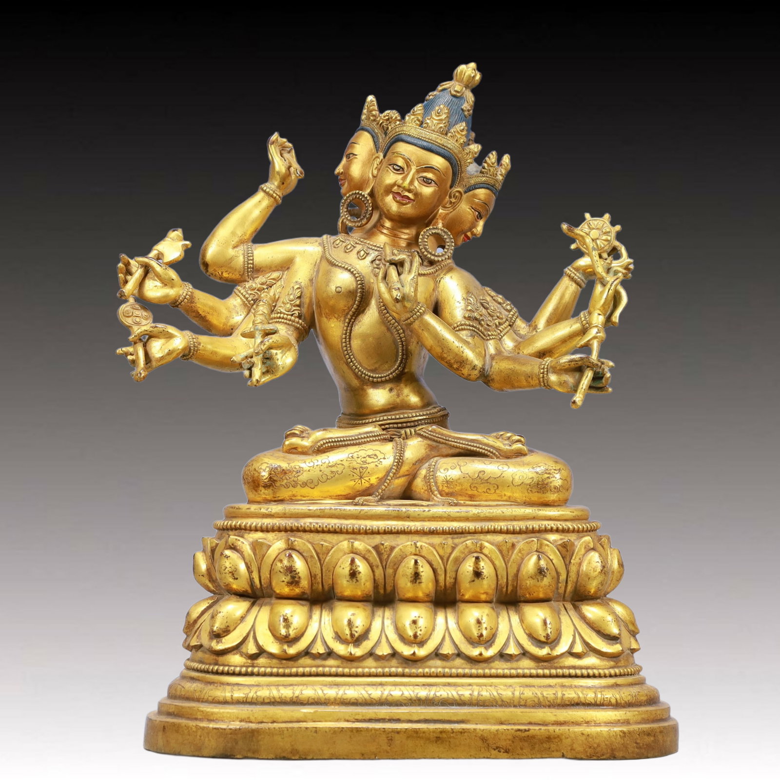A Solemn Gilt Bronze Eight-arms Statue of Avalokitesvara: A Solemn Gilt Bronze Eight-arms Statue of Avalokitesvara,Ming Dynasty, China,Size:12.8inx7.1inx15.2in Weight:11500g 铜鎏金八臂观音像,中国