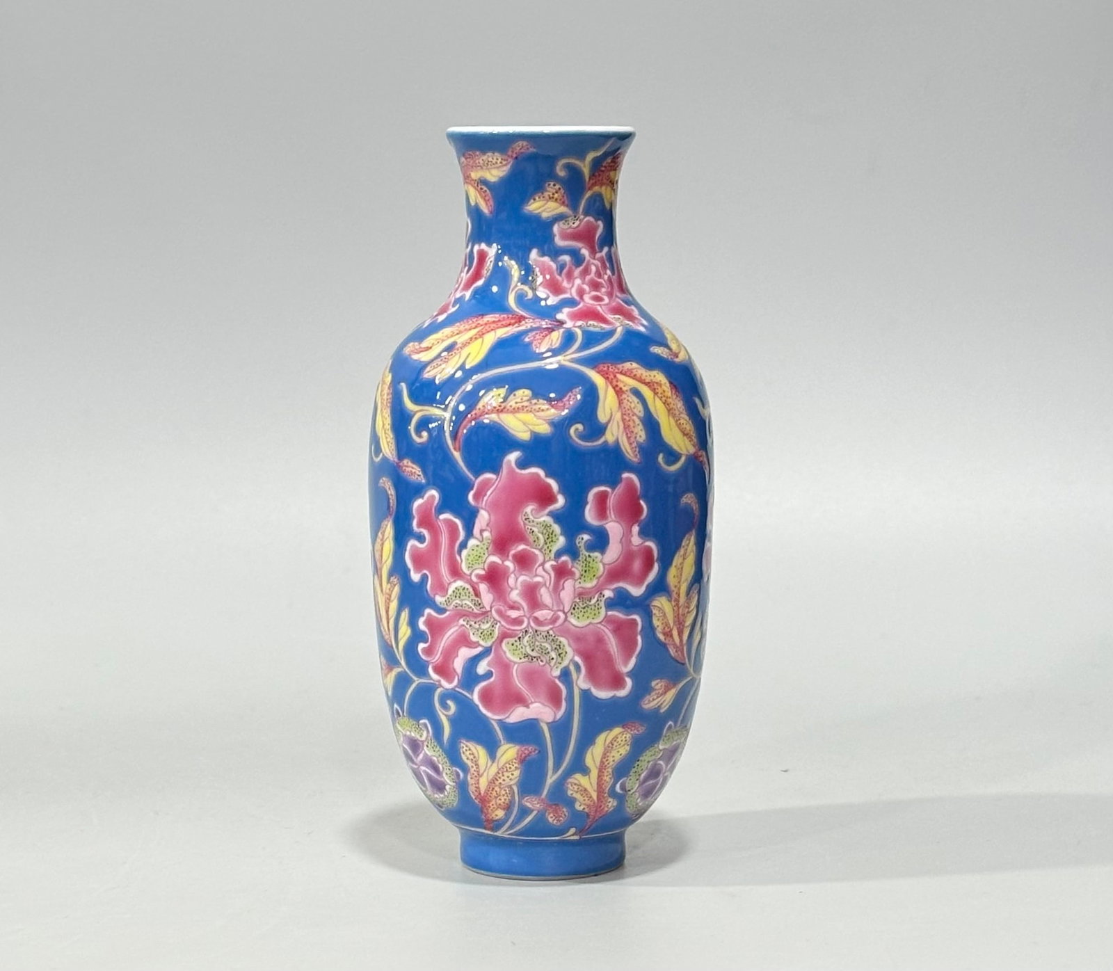 An Exquisite Blue Ground Enamel Flower Pattern Vase: An Exquisite Blue Ground Enamel Flower Pattern Vase,Qing Dynasty,China,Kangxi Four-character Mark,Size:5.3inx2.4in 蓝地珐琅彩花卉纹瓶,中
