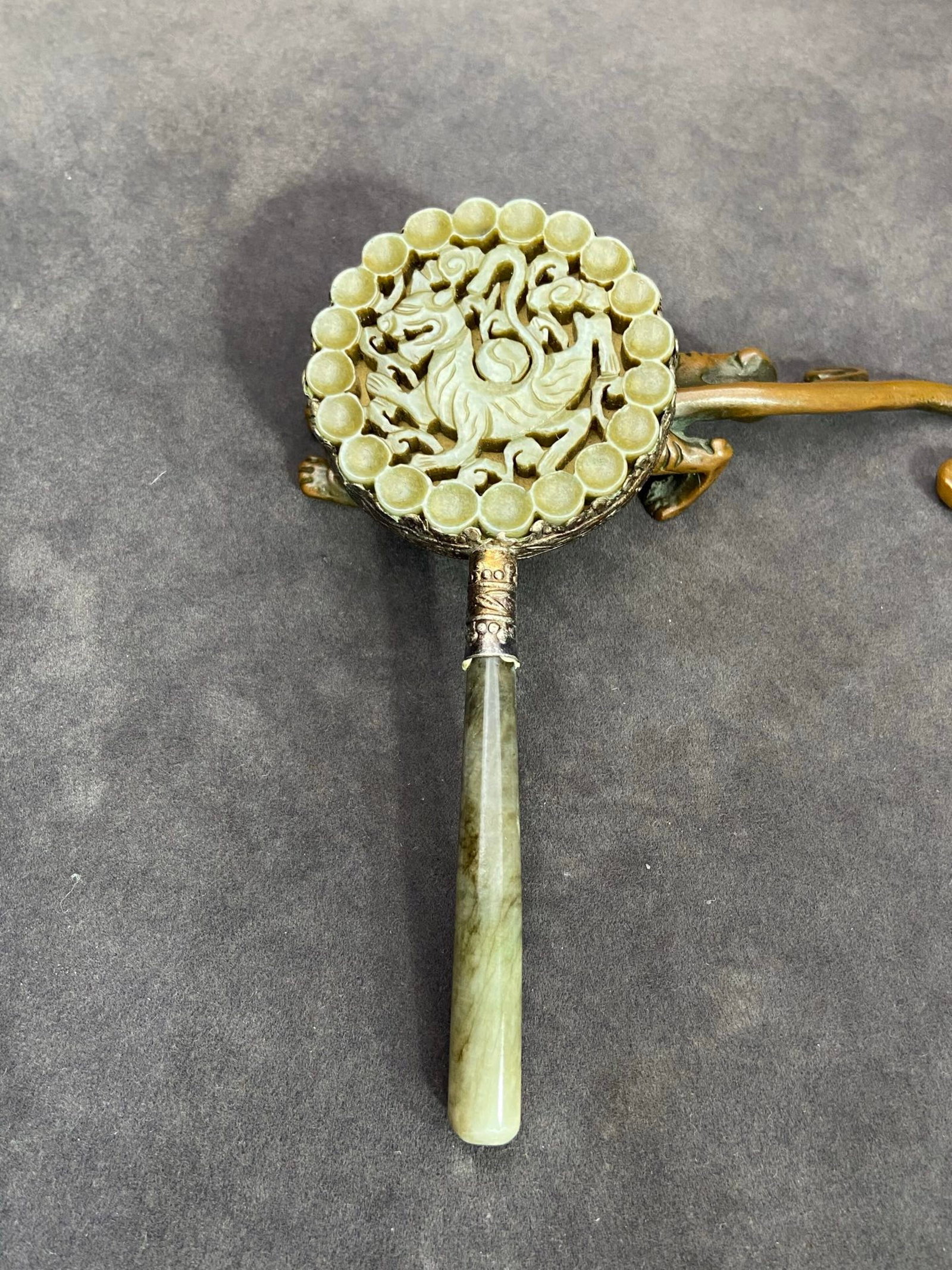 An Exquisite Silver Inlaid White Jade Hollow Dragon Pattern Hand Mirror: An Exquisite Silver Inlaid White Jade Hollow Dragon Pattern Hand Mirror,Qing Dynasty,China,Size:5.5inx2.3inx0.5in,Weight:74g 银镶白玉镂空龙纹手