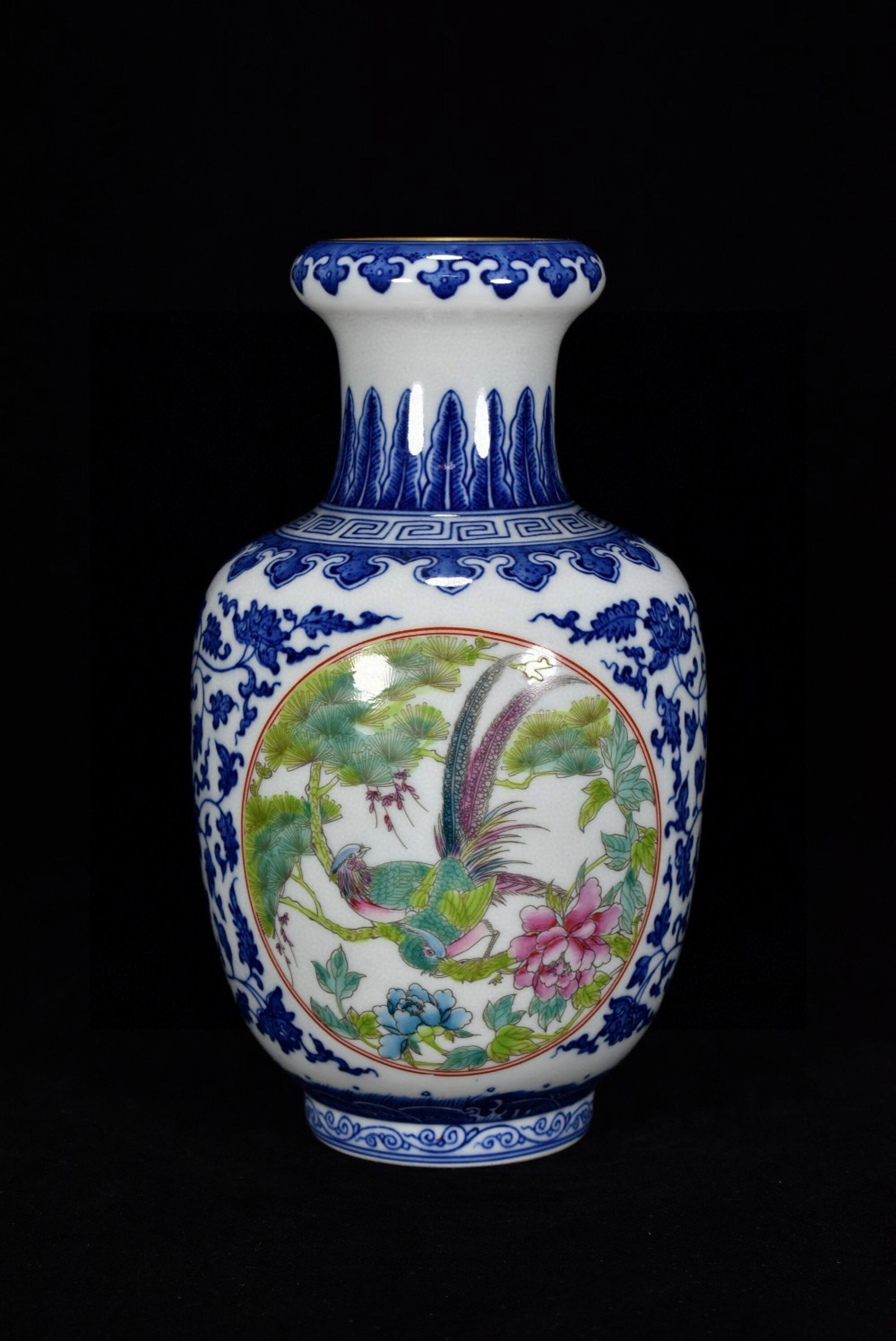 An Exquisite Blue and White Flower and Phoenix Pattern Vase: An Exquisite Blue and White Flower and Phoenix Pattern Vase,Qing Dynasty,China,Qianlong Six-character Mark,Size:8.3inx5.1in
