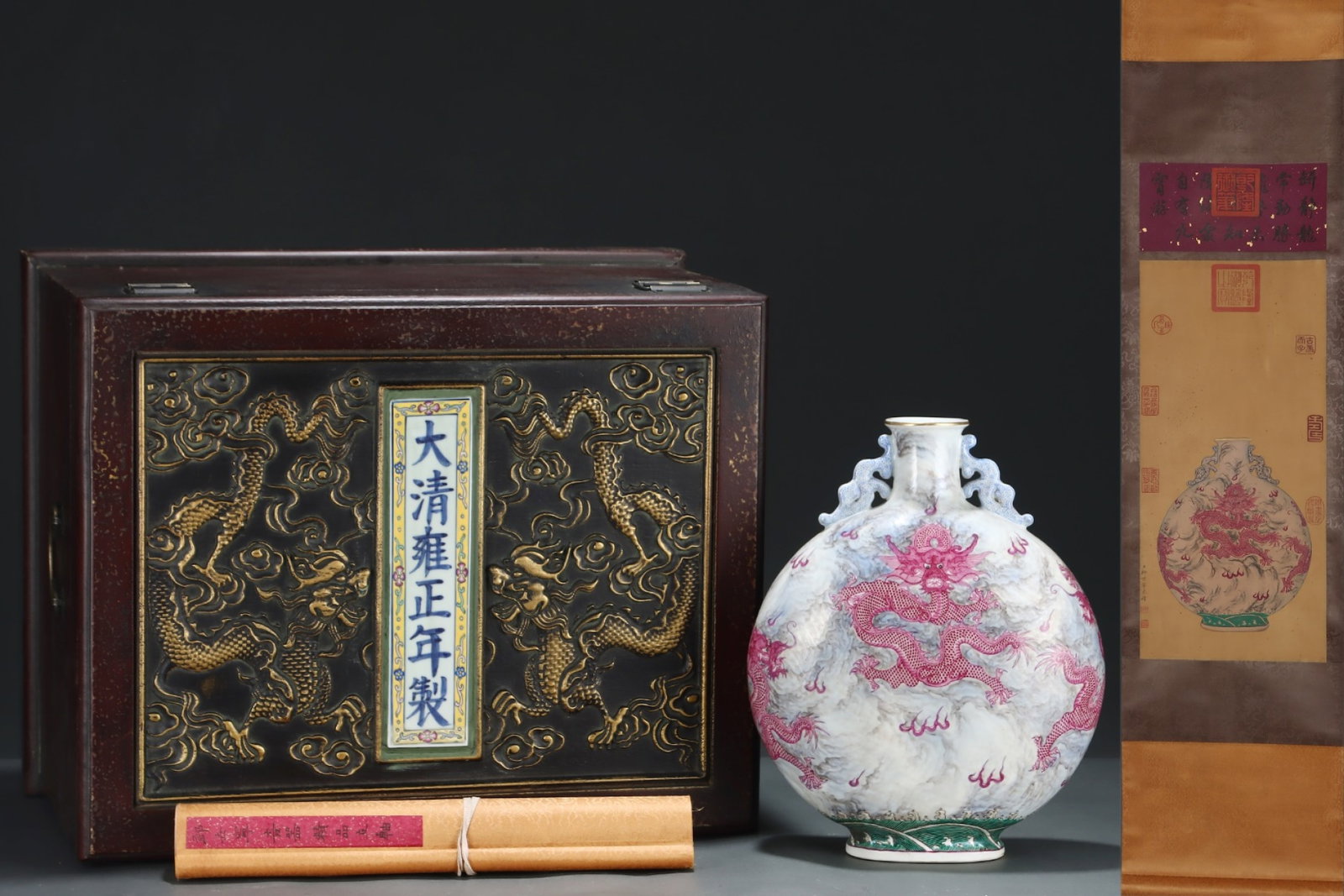 A Rare Ink Color Ruby Red-Glazed Auspicious Cloud and Dragon Pattern Double-Ears Vase,with Chinese: A Rare Ink Color Ruby Red-Glazed Auspicious Cloud and Dragon Pattern Double-Ears Vase,with Chinese Vertical Scroll Ink Painting on Silk,Qing Dynasty,China,Yongzheng Six-character Mark,Size:(Without fr