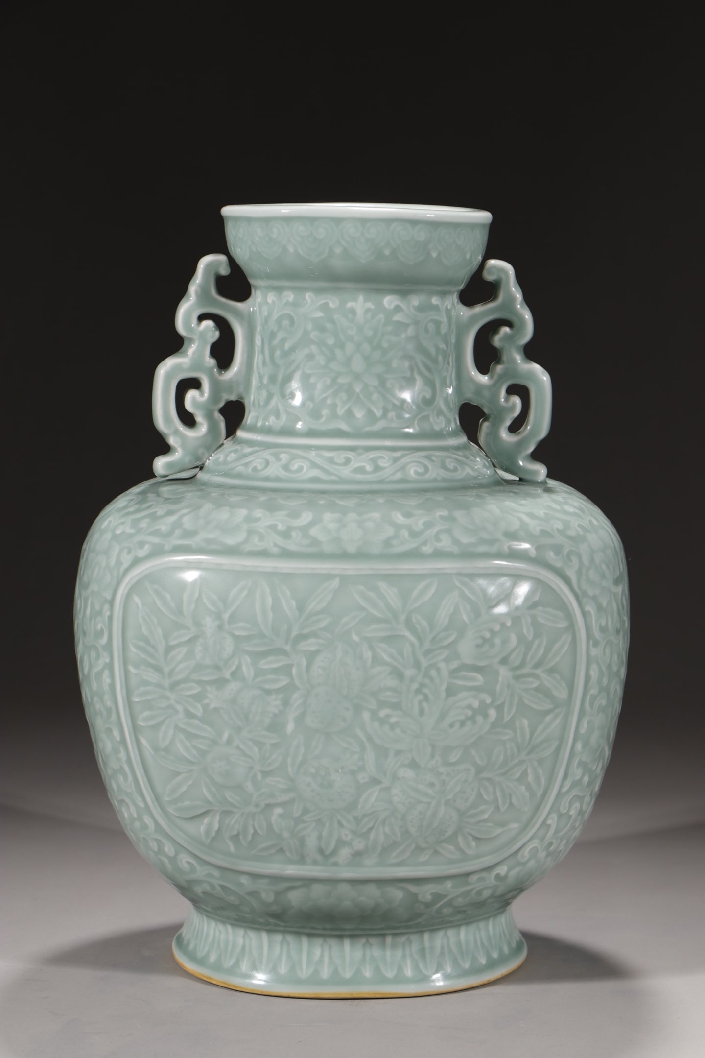 A Rare Celadon Glazed Lotus and Fruit Pattern Double-Ears Vase: A Rare Celadon Glazed Lotus and Fruit Pattern Double-Ears Vase,Qing Dynasty,China,Qianlong Six-character Mark,Size:14.4in 粉青釉缠枝莲果纹双೑