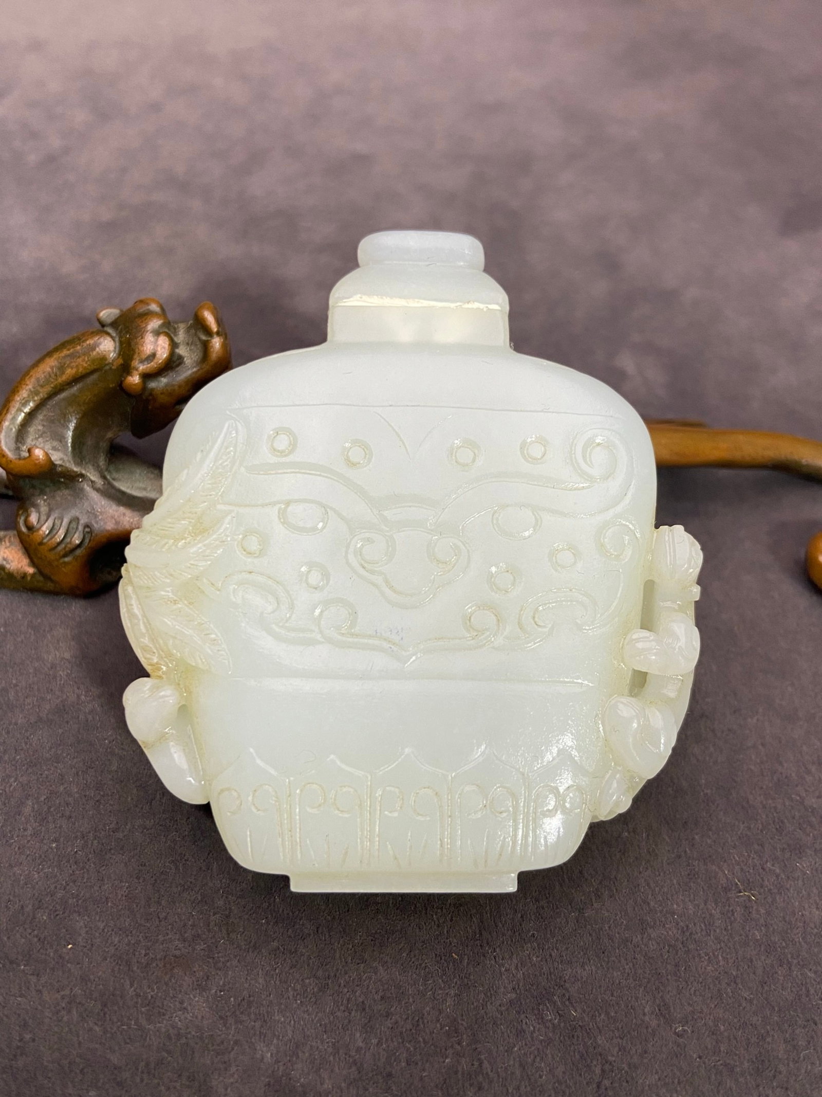 An Exquisite White Jade Dragon and Phoenix Pattern Snuff Bottle: An Exquisite White Jade Dragon and Phoenix Pattern Snuff Bottle,Qing Dynasty,China,Size:2.7inx2.4inx0.7in,Weight:90g 白玉龙凤纹鼻烟壶,中国&#