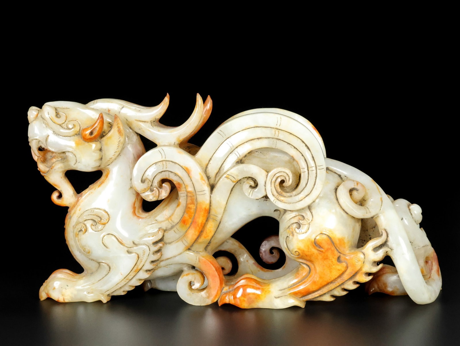 An Exquisite White Jade Auspicious Beast Ornament: An Exquisite White Jade Auspicious Beast Ornament,Qing Dynasty,China,Size:5.5inx10.2inx2.8in,Weight:1930g 白玉瑞兽摆件,中国清代