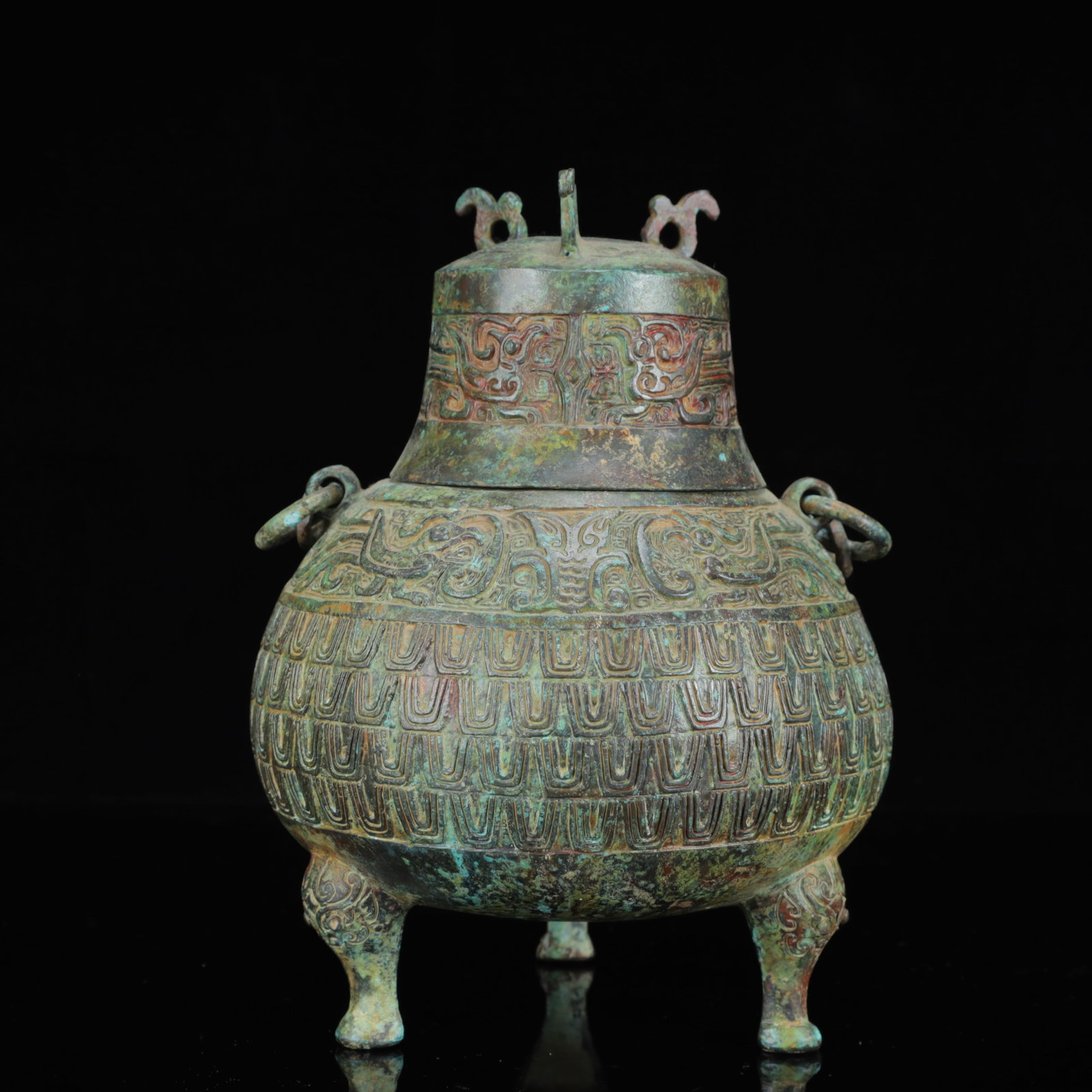 An Archaic Bronze Figure-Face Pattern Dragon-Ears Beast Legs Cover Jar,with Inscription: An Archaic Bronze Figure-Face Pattern Dragon-Ears Beast Legs Cover Jar,with Inscription,the Warring States Period in China,Size:6.3inx10.2in,Weight:2200g 青铜人面纹࿵