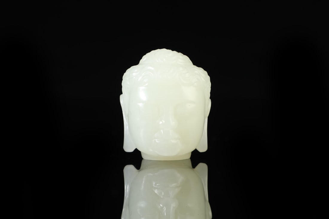 An Exquisite White Jade Buddha-head Pendant: An Exquisite White Jade Buddha-head Pendant,Qing Dynasty,China,Size:1.4inx1.2in,Weight:46.5g