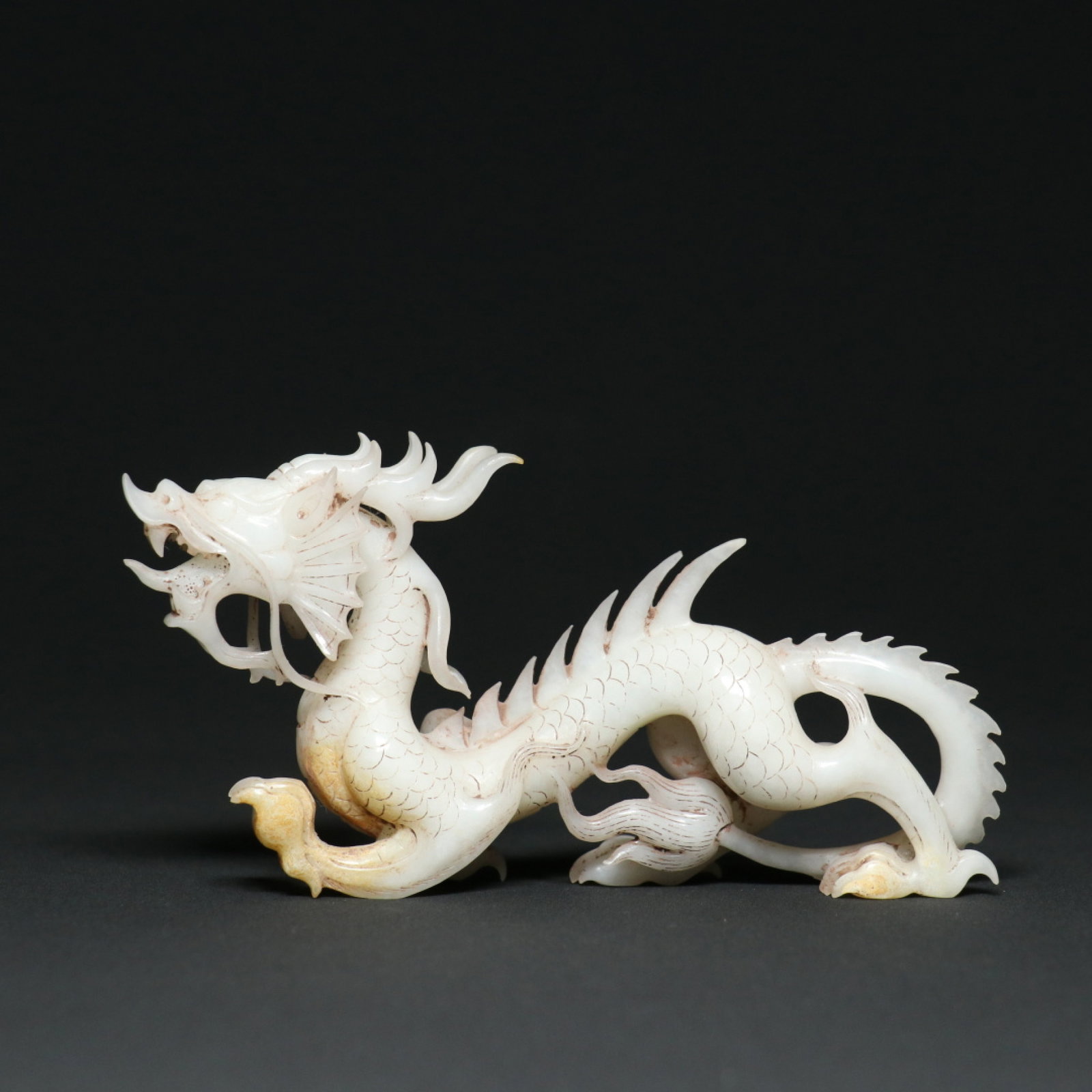 An Exquisite White Jade Dragon Ornament: An Exquisite White Jade Dragon Ornament,Han Dynasty,China,Size:5.6inx1.1inx3in,Weight:154.2g 白玉龙摆件,中国汉代