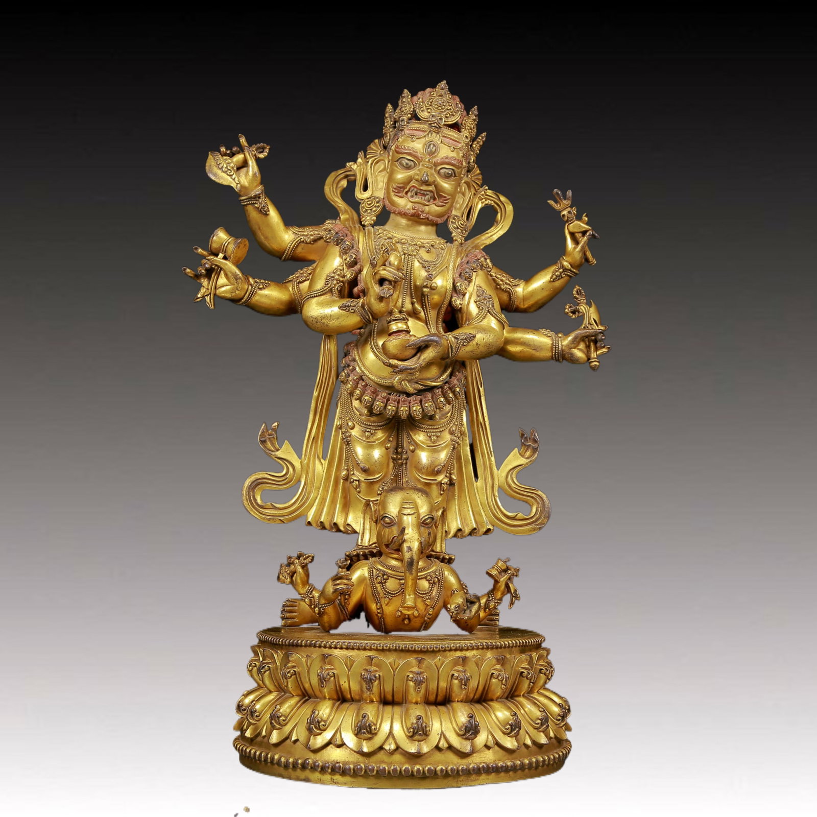 A Magnificent Gilt-Bronze Figure Of Vajrapani: Magnificent Gilt-Bronze Figure Of Vajrapani. Stood on a prostrating figure with a wrathful expression, body adorned with jewelry ornaments, topknot surmounted by a splendid diadem, holding ritual item