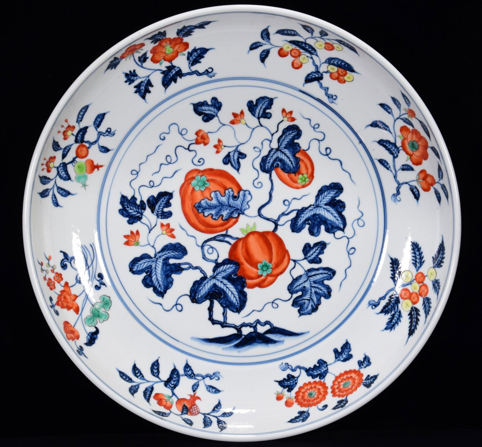 An Exquisite Wucai Melon and Fruit Pattern Plate: An Exquisite Wucai Melon and Fruit Pattern Plate,Ming Dynasty,China,Xuande Six-character Mark,Size:3inx18.1in 五彩瓜果纹盘,中国明代,宣
