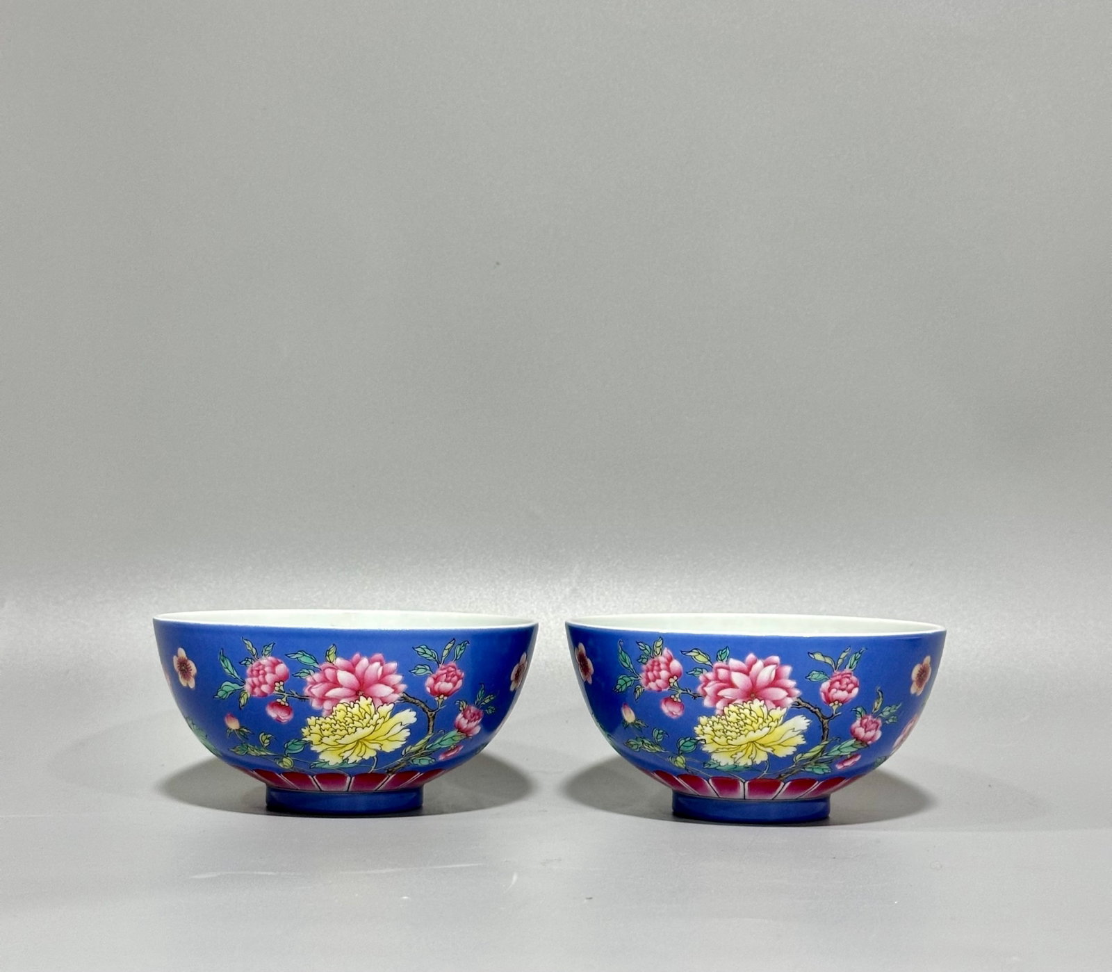 A Pair of Exquisite Blue Ground Enamel Flower Pattern Bowls: A Pair of Exquisite Blue Ground Enamel Flower Pattern Bowls,Qing Dynasty,China,Kangxi Four-character Mark,Size:2.4inx4.9in 一对蓝地珐琅彩花卉ń