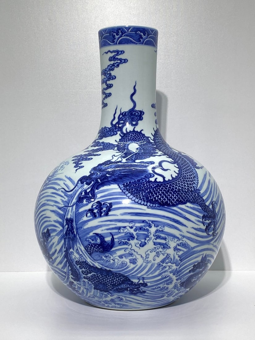A Huge Blue and White Seawater and Dragon Pattern Vase: A Huge Blue and White Seawater and Dragon Pattern Vase,Qing Dynasty,China,Qianlong Six-character Mark,Size:21.3inx16.5in
