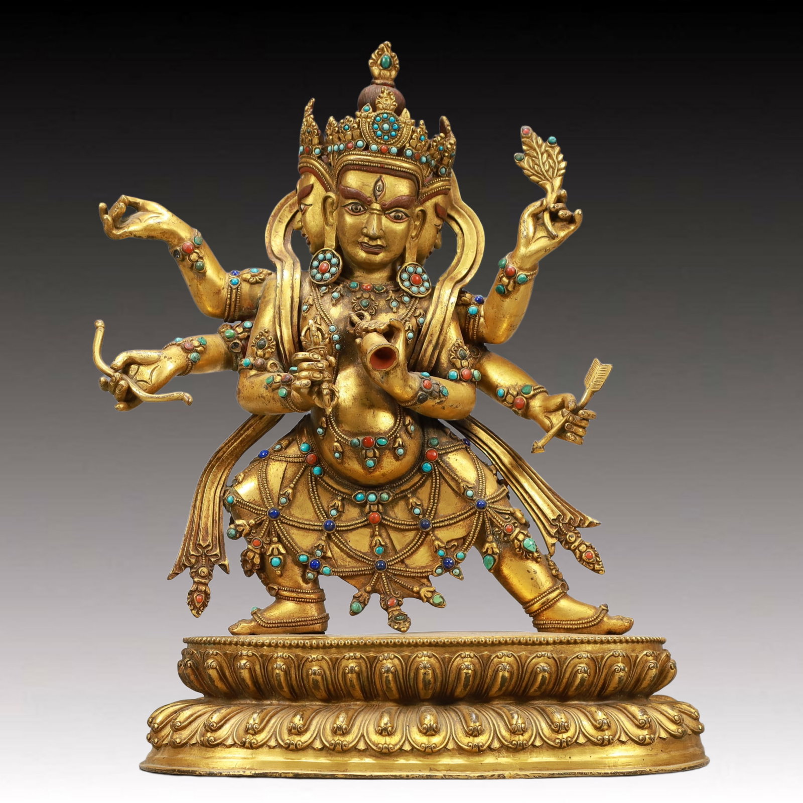 A Solemn Gilt Bronze Statue of Three-Headed and Six-Armed Vajra,Inlaid Turquoise: A Solemn Gilt Bronze Statue of Three-Headed and Six-Armed Vajra,Inlaid Turquoise,Ming Dynasty, China,Size:10inx4.3inx14.2in,Weight:6550g 铜鎏金三头六臂金