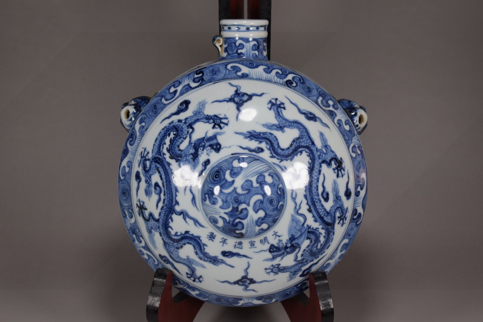 An Exquisite Blue and White Seawater Dragon Pattern pot: An Exquisite Blue and White Seawater Dragon Pattern pot,Ming Dynasty,China,Xuande Six-character Mark,Size:11.8inx11in 青花海水龙纹壶,中国明&