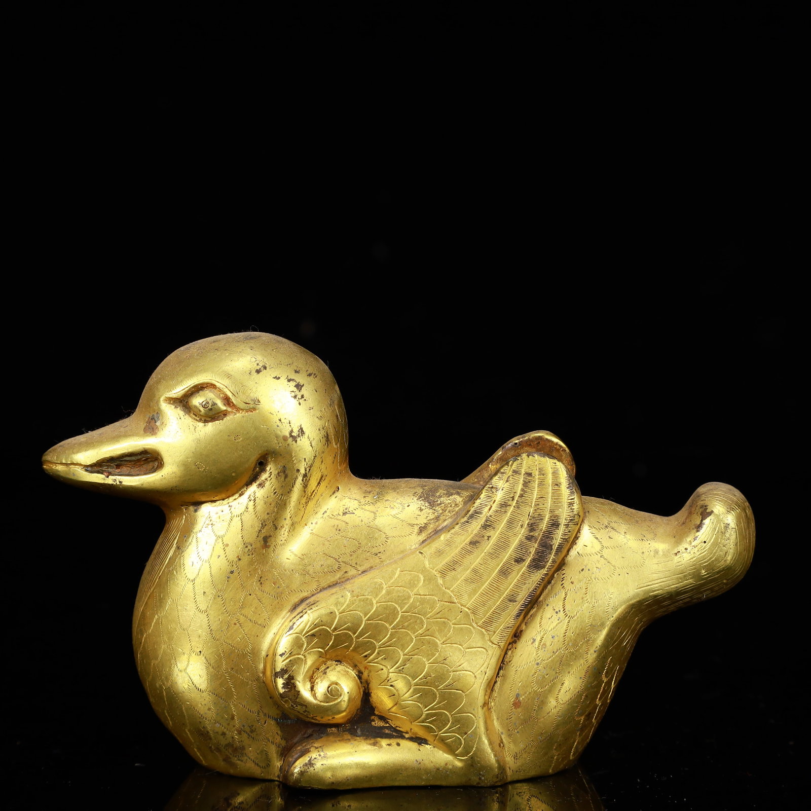 A Rare Gilt Bronze Duck Ornament: A Rare Gilt Bronze Duck Ornament,The Warring States period in China,Size:4.9inx1.8inx3.1in,Weight:400g 铜鎏金鸭摆件,中国战国时期