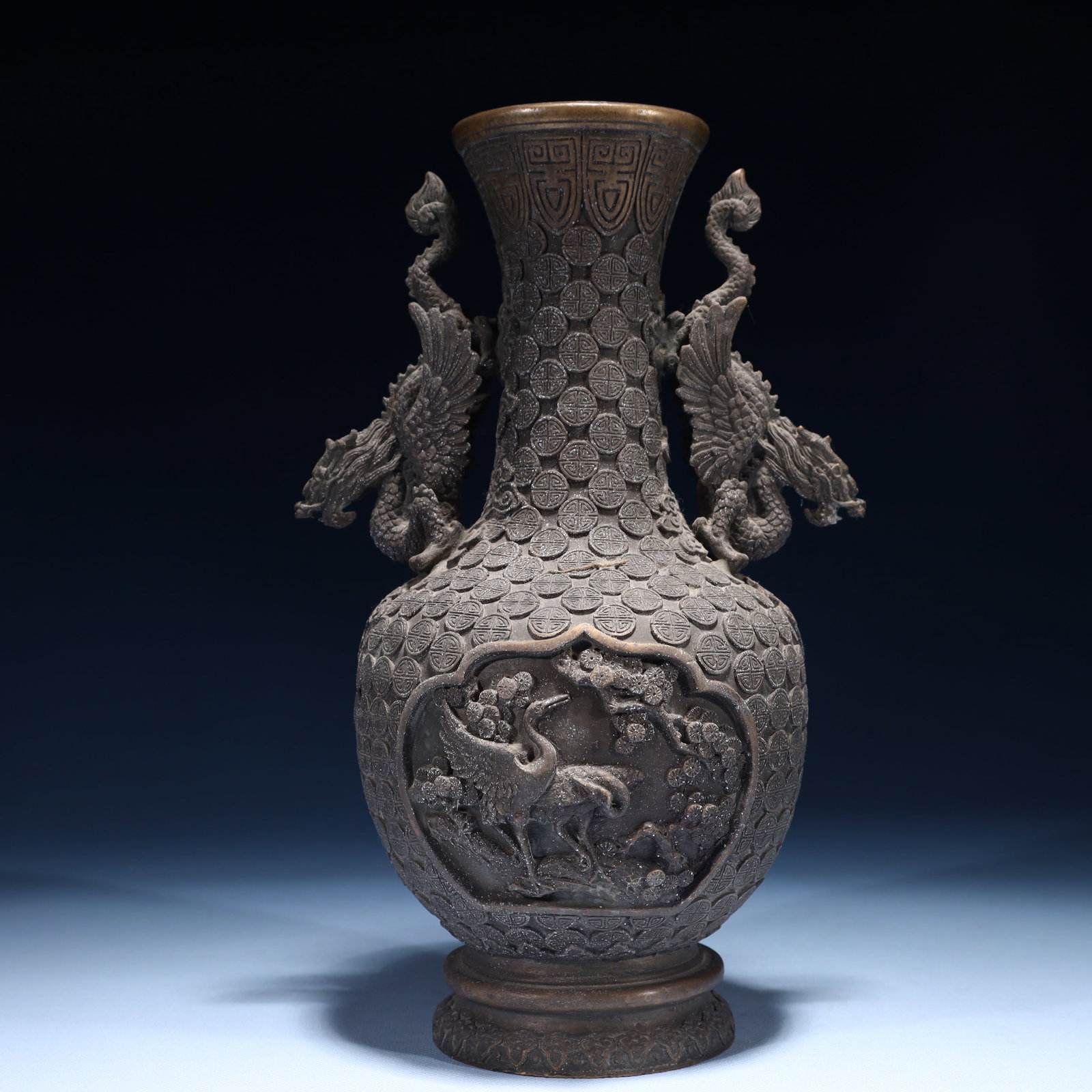 An Exquisite Bronze Flower and Crane Pattern Dragon-Ears Vase: An Exquisite Bronze Flower and Crane Pattern Dragon-Ears Vase,Qing Dynasty,China,Size:6.7inx5.1inx10.6in,Weight:2350g 铜花卉鹤纹龙耳瓶,中国&