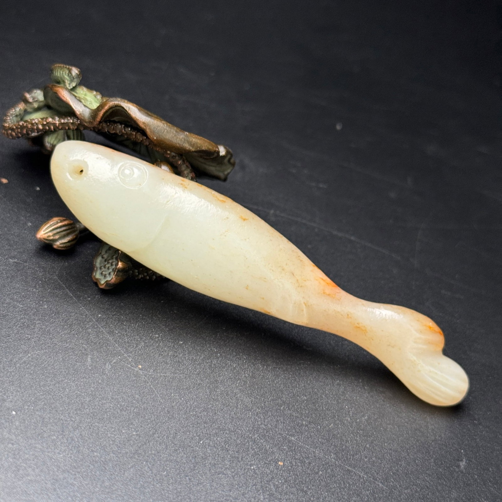 An Exquisite White Jade Fish Hand Piece: An Exquisite White Jade Fish Hand Piece,Qing Dynasty,China,Size:4.1inx0.8inx0.6in,Weight:46g 白玉鱼手把件,中国清代