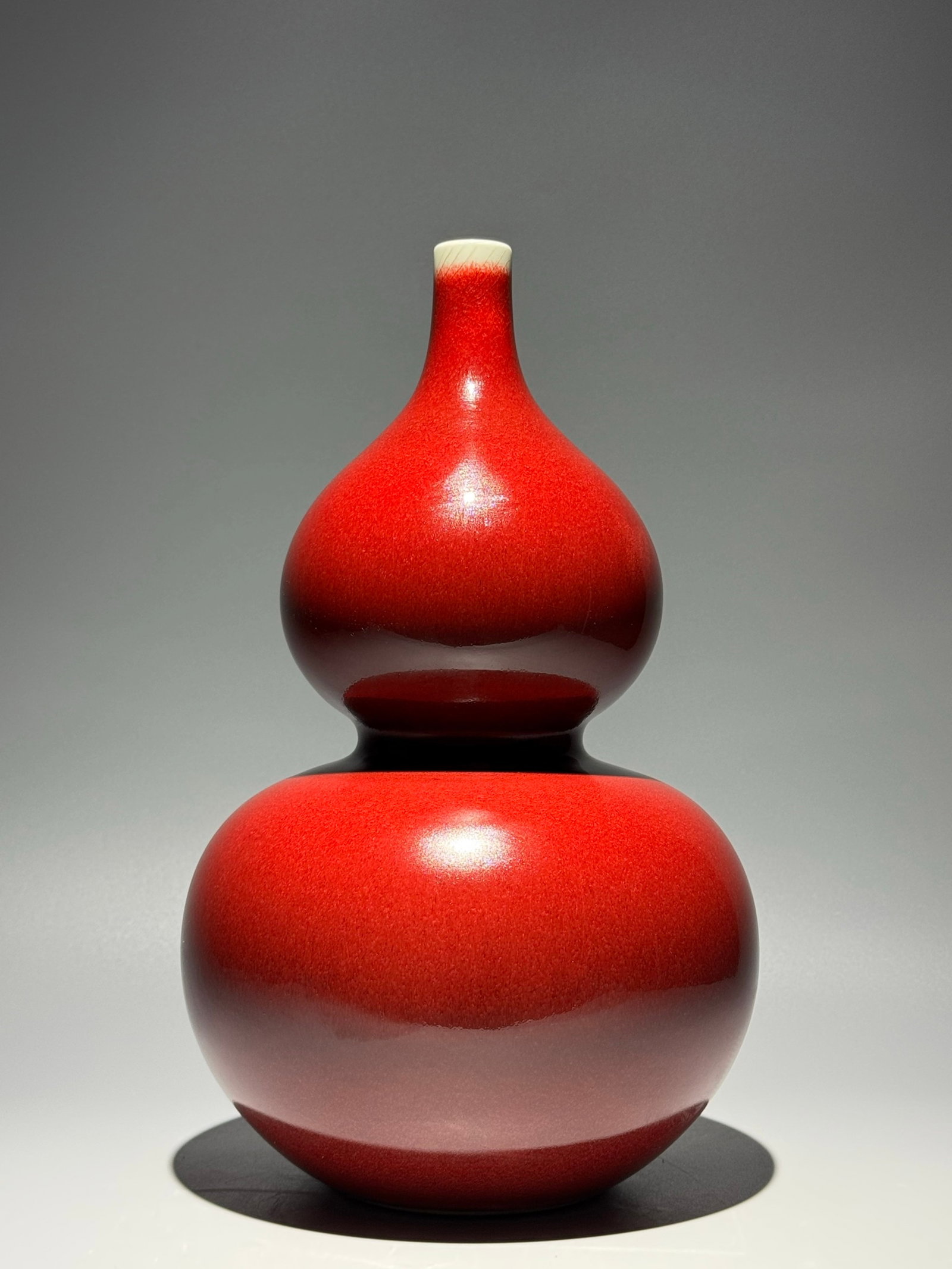 A Rare Red Glazed Gourd-Shaped Vase: A Rare Red Glazed Gourd-Shaped Vase,Qing Dynasty,China,Qianlong Six-character Mark,Size:12.6inx7.7in