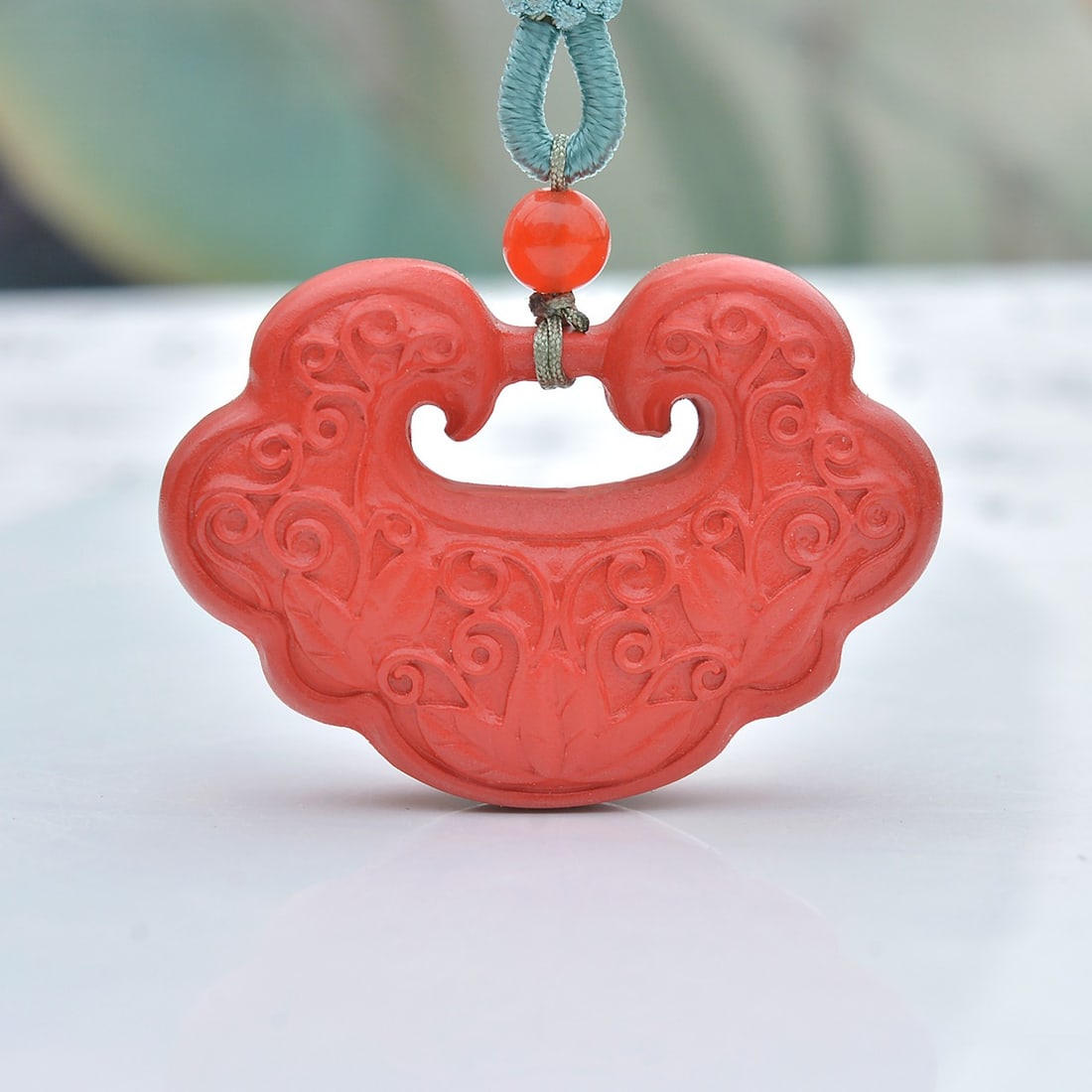 An Exquisite Cinnabar Lotus Pattern Lock-Shaped Pendant: An Exquisite Cinnabar Lotus Pattern Lock-Shaped Pendant,Size:1inx1.5in (寓意)吉祥招财喜庆、驱邪避凶、安神