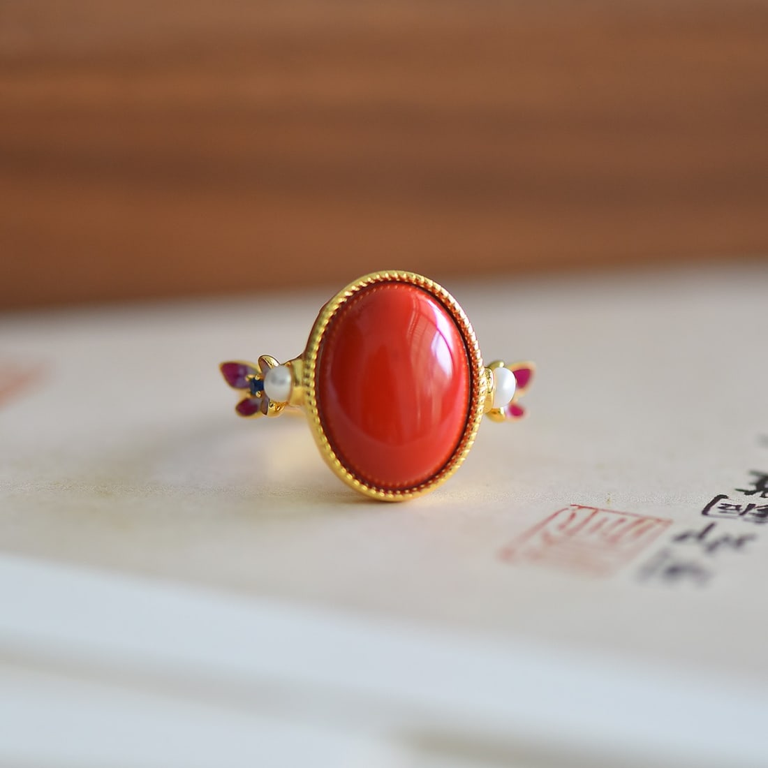 An Exquisite Sterling Silver-Gold Plated Inlaid Cinnabar Ring: An Exquisite Sterling Silver-Gold Plated Inlaid Cinnabar Ring,Size:0.5inx0.6in 寓意:彩蝶双飞、破茧成蝶