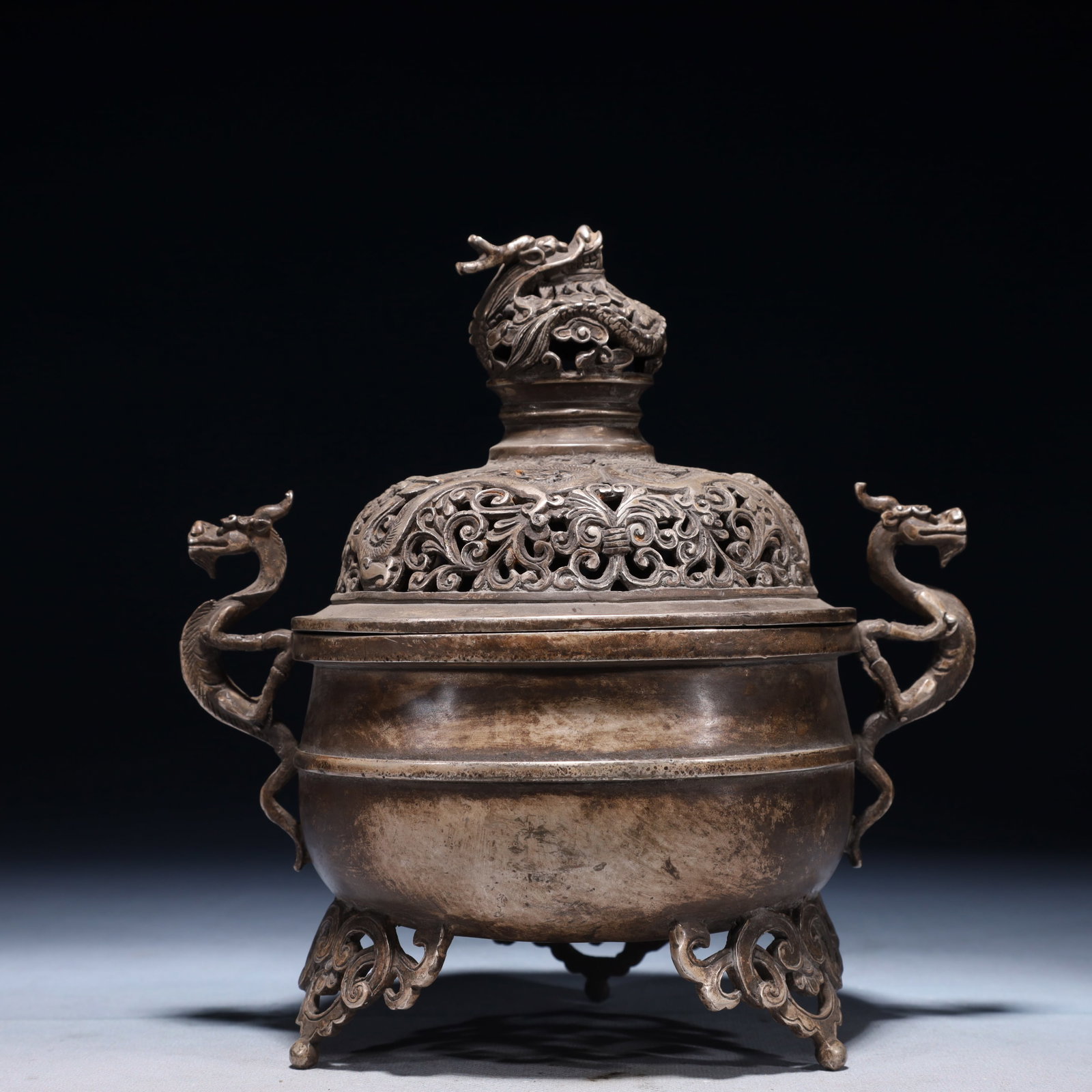 An Exquisite Silver-plated Bronze Lotus Pattern Double-Ears and Tripod Censer: An Exquisite Silver-plated Bronze Lotus Pattern Double-Ears and Tripod Censer,Qing Dynasty,China,Qianlong Four-character Mark,Size:8.3inx5.9inx9.1in,Weight:1750g 铜镀银缠ੜ