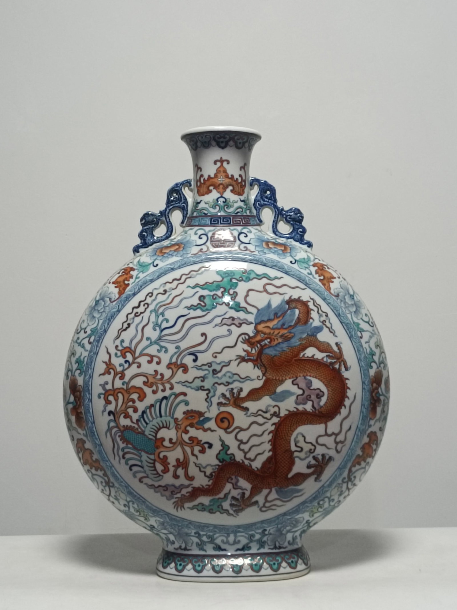 A Huge Blue and White Doucai Dragon and Phoenix Pattern Double-Ears Vase: A Huge Blue and White Doucai Dragon and Phoenix Pattern Double-Ears Vase,Qing Dynasty,China,Qianlong Six-character Mark,Size:22.8inx16.9in 青花斗彩龙凤纹Ö