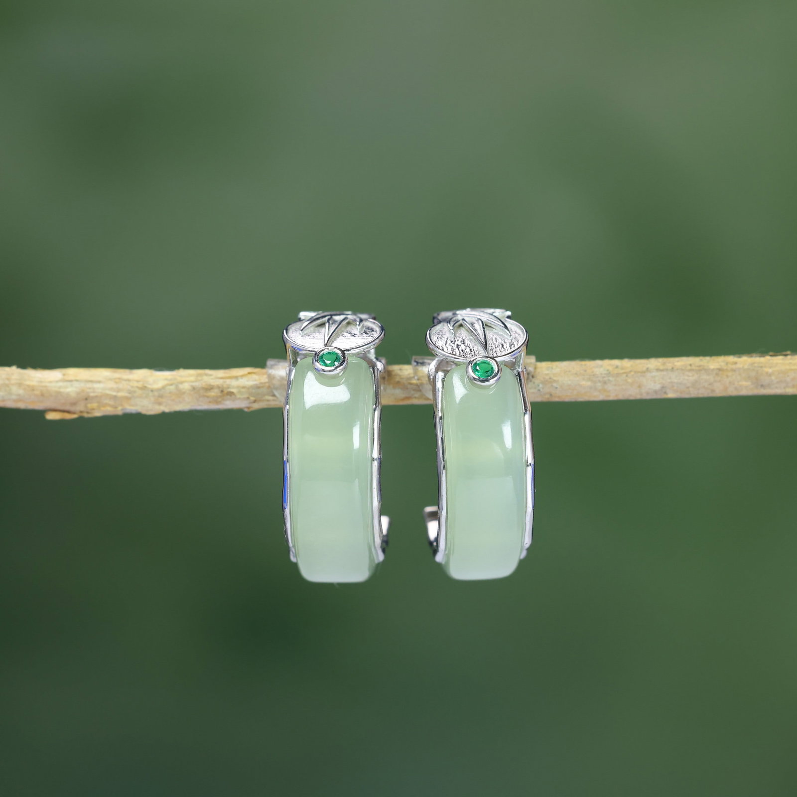 A Pair of Exquisite Sterling Silver Inlaid Greenish Jade Earrings: A Pair of Exquisite Sterling Silver Inlaid Greenish Jade Earrings , Size :0.2inx0.7in 一对纯银镶青白玉耳环,尺寸:0.2inx0.7in