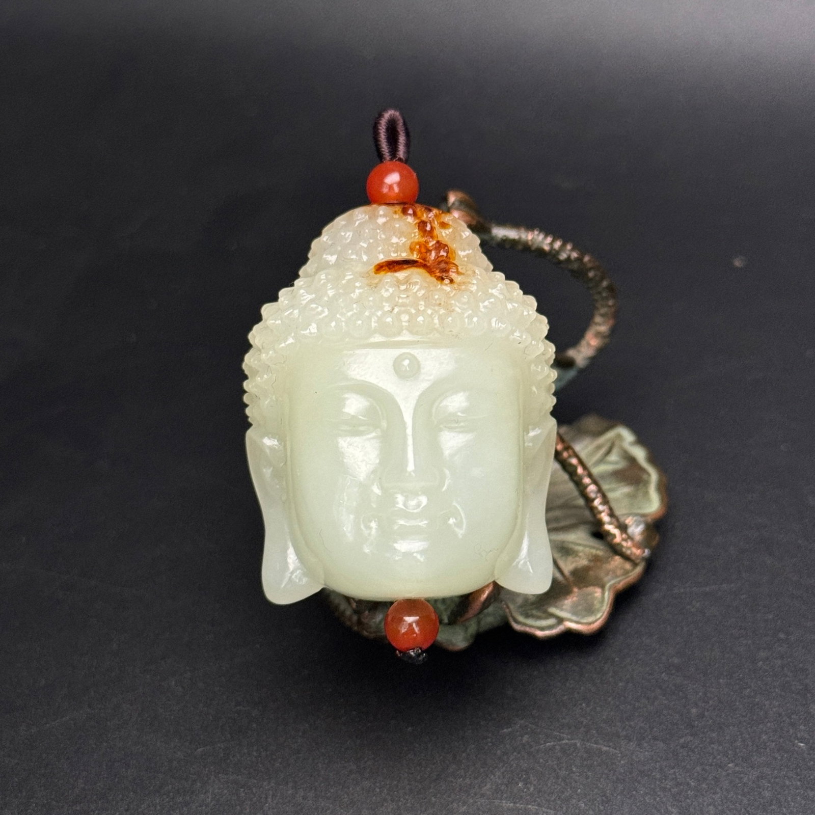 An Exquisite White Jade Statue of Buddha Head Ornament: An Exquisite White Jade Statue of Buddha Head Ornament,Qing Dynasty,China,Size:1.8inx1.4inx1.3in,Weight:82g 白玉佛头像摆件,中国清代
