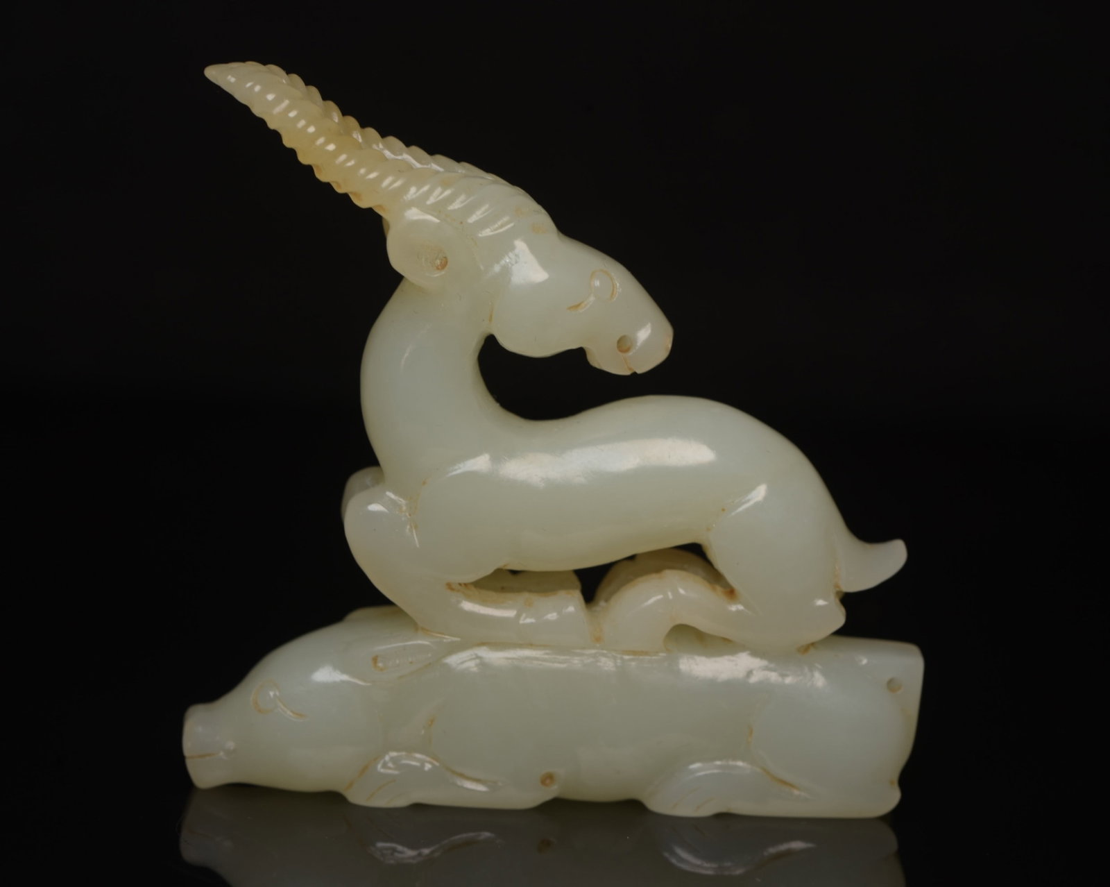 An Exquisite White Jade Sheep Ornament: An Exquisite White Jade Sheep Ornament,Qing Dynasty,China,Size:2.7inx2.7inx0.5in,Weight:72g 白玉羊摆件,中国清代