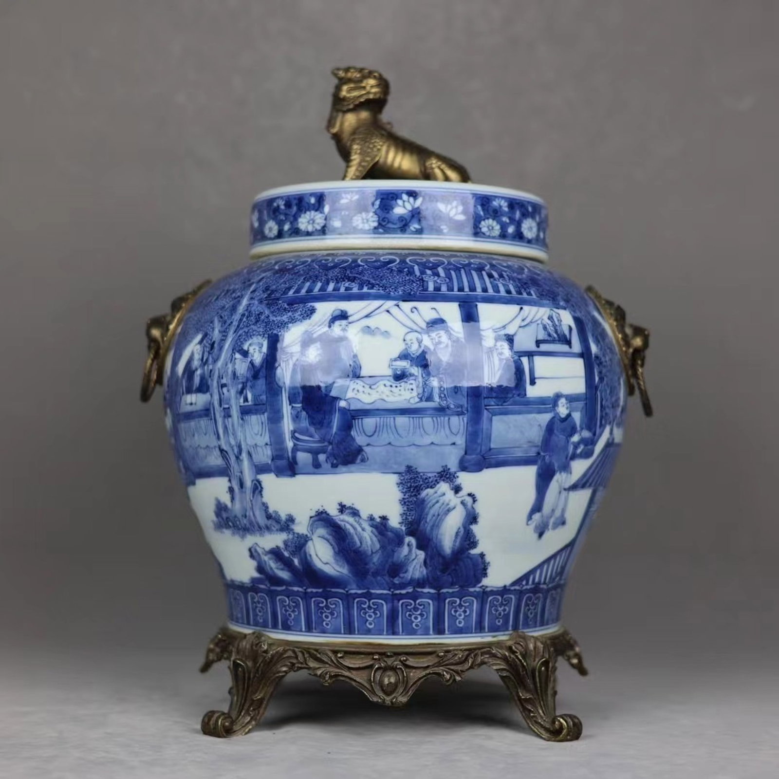 A Huge Blue and White Inlaid Bronze Character and Story Pattern Lion-Ears Jar with Cover: A Huge Blue and White Inlaid Bronze Character and Story Pattern Lion-Ears Jar with Cover,Qing Dynasty,China,Qianlong Six-character Mark,Size:17.3inx12.6in 青花镶铜人Ĥ