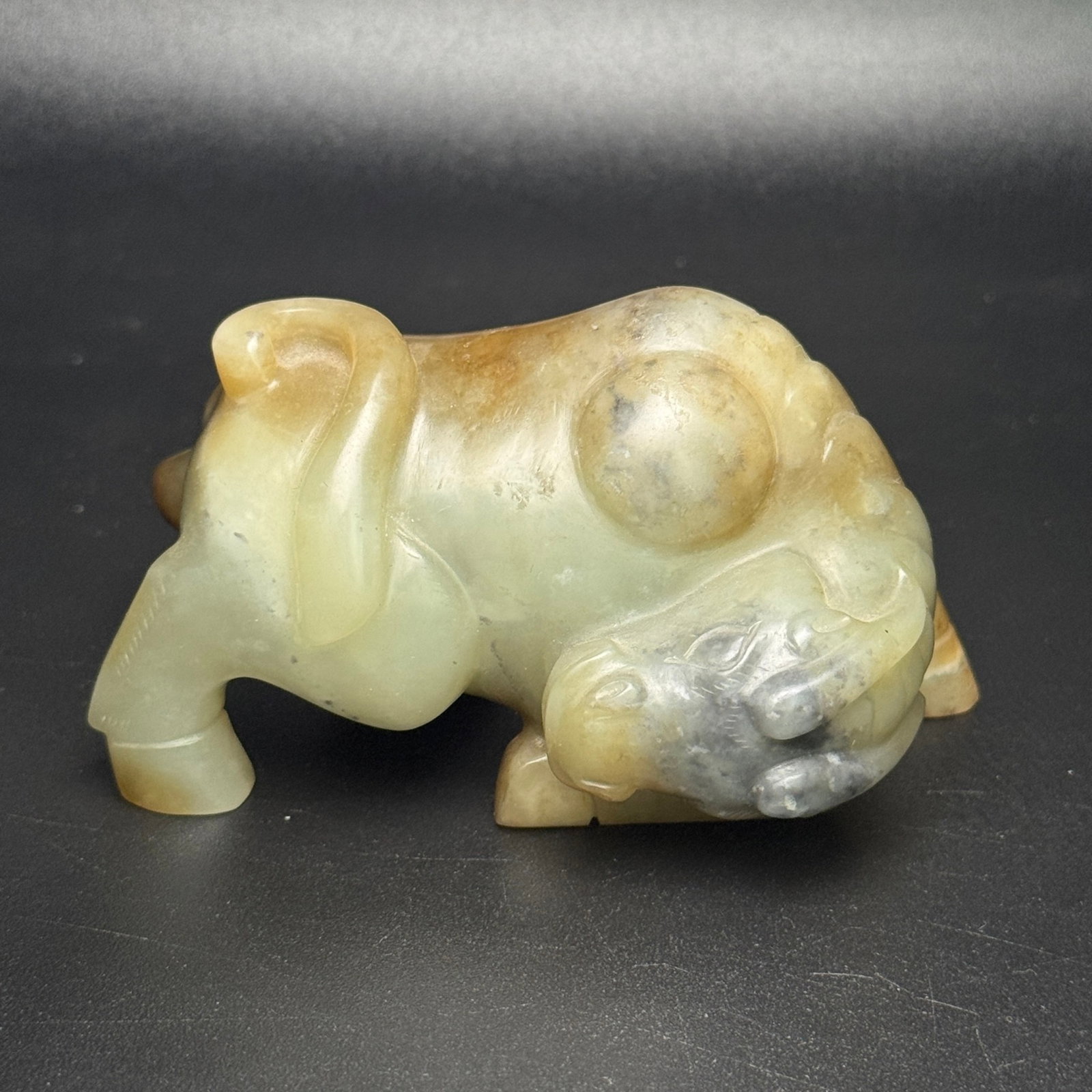 An Exquisite White Jade Buffalo Ornament: An Exquisite White Jade Buffalo Ornament,Qing Dynasty,China,Size:3.7inx2inx2.1in,Weight:314g 白玉牛摆件,中国清代