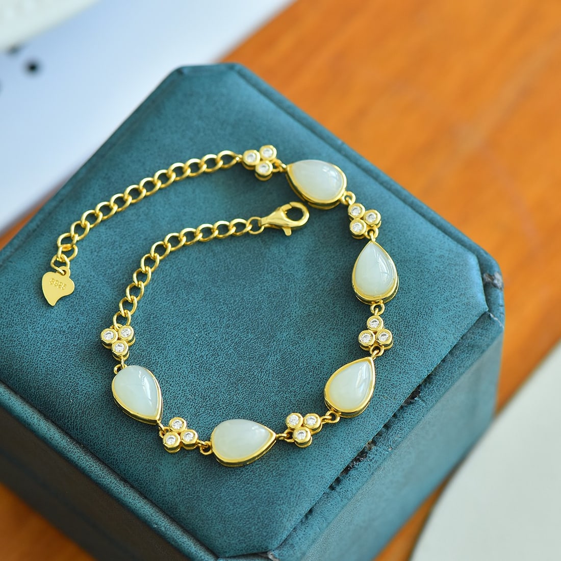 An Exquisite Sterling Silver-Gold Plated Inlaid White Jade Bracelet: An Exquisite Sterling Silver-Gold Plated Inlaid White Jade Bracelet,Size:0.2inx0.7in 纯银镀金镶白玉手链
