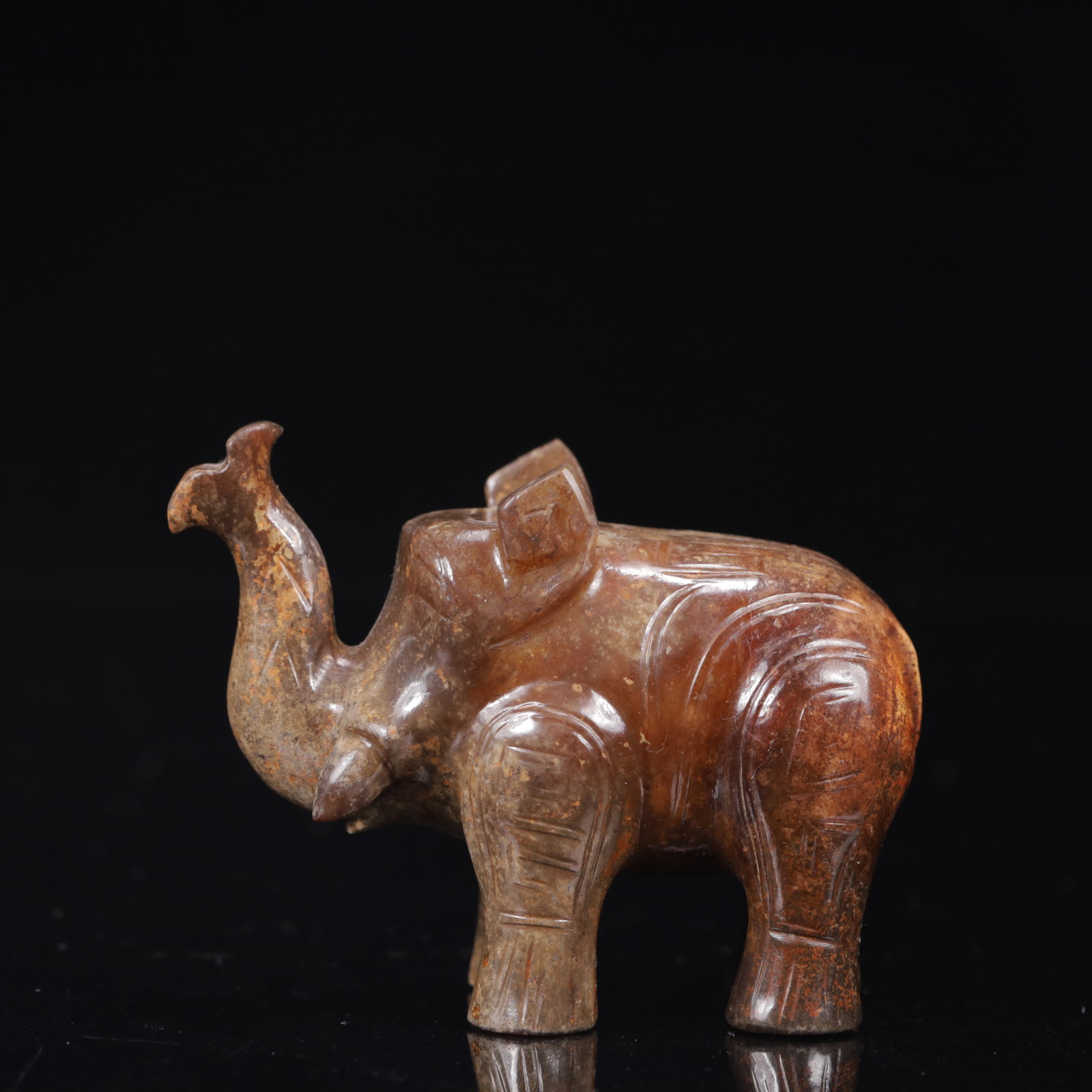 An Exquisite Gaogu Jade Elephant Ornament: An Exquisite Gaogu Jade Elephant Ornament,Qing Dynasty,China,Size:2.8inx1.6inx2.4in,Weight:195g 高古玉象摆件,中国清代